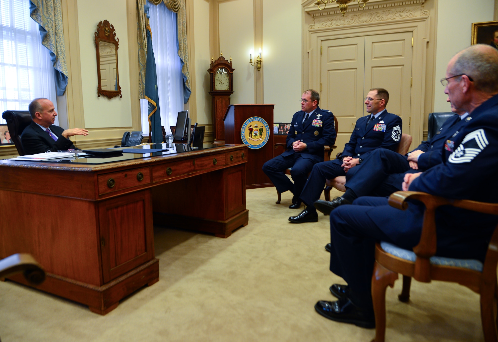 Jack Markell, Governor of Delaware, speaks with senior leaders from Dover Air Force Base, Del., April 29, 2014, in the Governor’s office in Dover, Del. Markell signed a proclamation to declare April 30 as the Day of Recognition of the Military Child. (U.S. Air Force photo/Airman 1st Class William Johnson)
