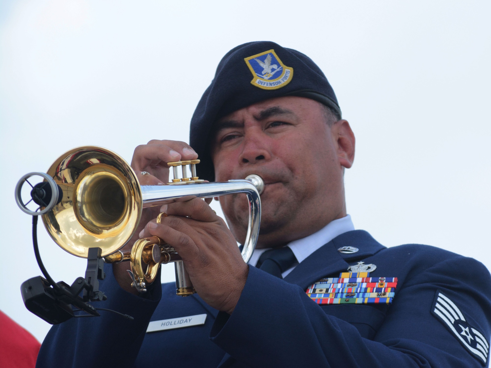 Staff Sgt. Johnny Holliday, 610th Security Forces Squadron, plays the National Anthem during the opening ceremony at this year's Air Power Expo at the Naval Air Station Fort Worth Joint Reserve Base, Texas. Saturday's total attendance was a single-day air show record for NAS Fort Worth JRB. (U.S. Air Force photo/Staff Sgt. Samantha Mathison)