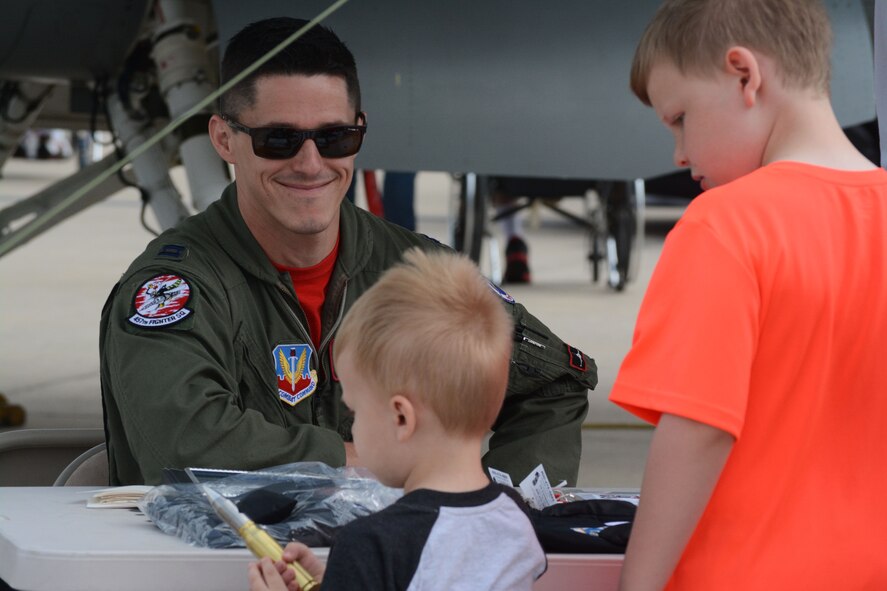 Capt. Matt Tucker, 457th Fighter Squadron, speaks with patrons during the 2014 Air Power Expo at Naval Air Station Fort Worth Joint Reserve Base, Texas. Saturday's total attendance was a single-day air show record for NAS Fort Worth JRB. (U.S. Air Force photo/Staff Sgt. Samantha Mathison)