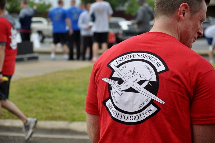 A runner wears a tribute t-shirt during the Indy 08 5k and 8k run at Beale Air Force Base, Calif., April 25, 2014. Shirts were sold at the event to help fund a permanent memorial. (U.S. Air Force photo by 1st Lt. J.B./Released)  