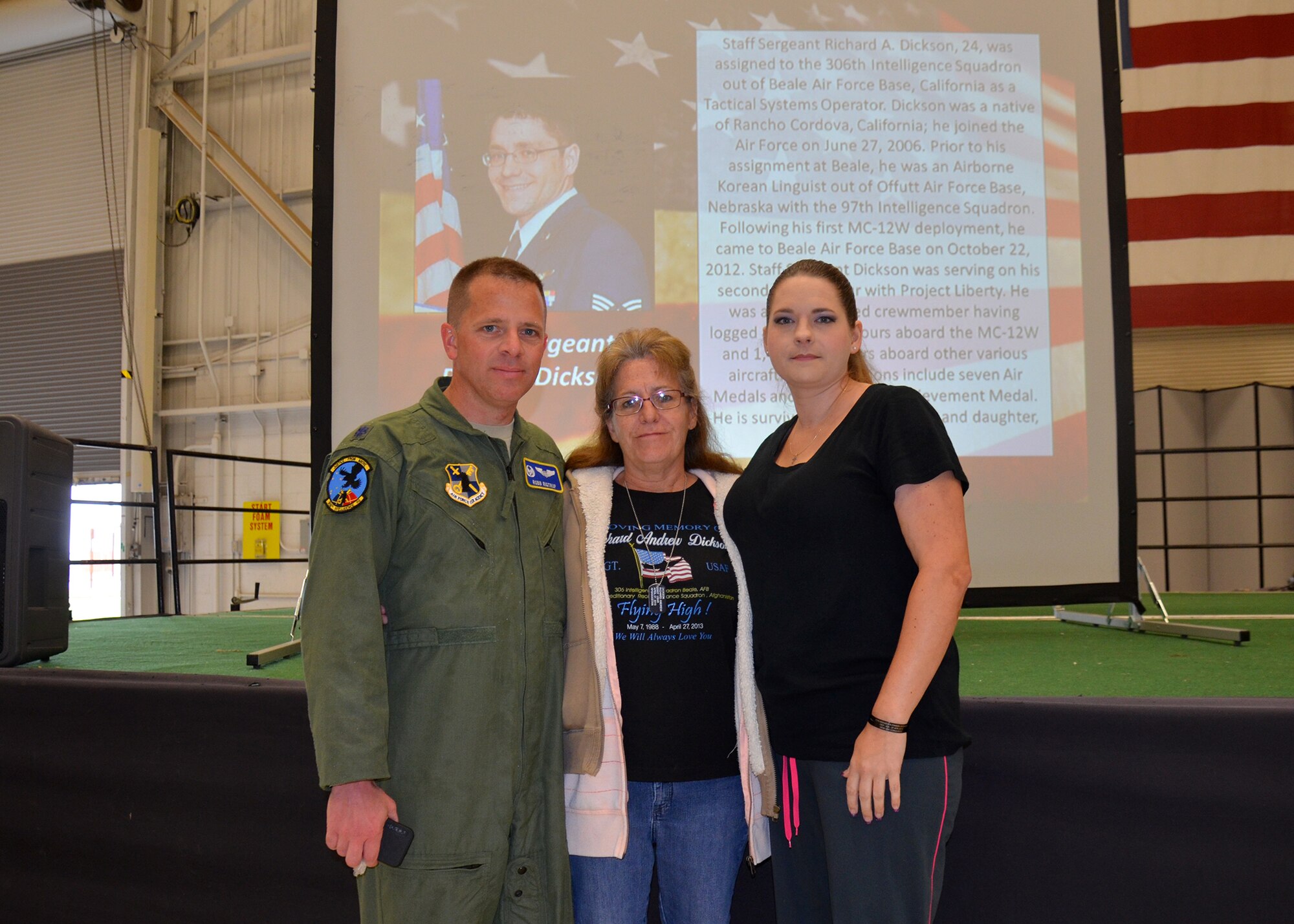 Lt. Col. Robb Rigtrup, 306th Intelligence Squadron commander, and family members of Staff Sgt. Richard Dickson attend a memorial service honoring four Airmen at Beale Air Force Base, Calif., April 25, 2014. Dickson was a native of Rancho Cordova, Calif. (U.S. Air Force photo by 2nd Lt. Siobhan Bennett/Released)