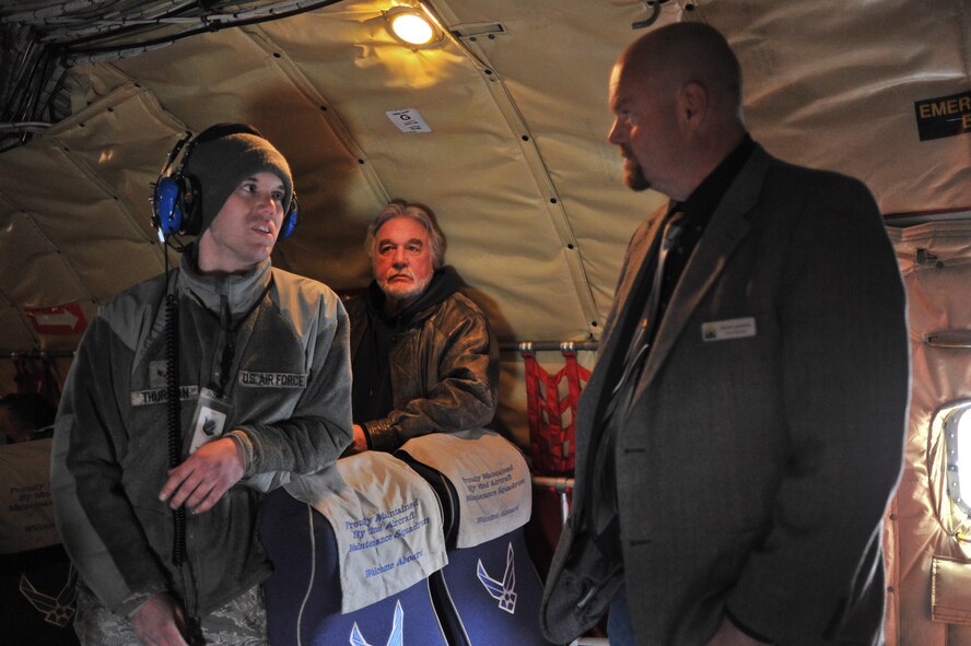 Senior Airman Nicholas Thurman talks with Steven Lawrence about his mission and career field requirements before an incentive flight at Fairchild Air Force Base, Wash., April 25, 2014.The Honorary Commanders and Eagles program pairs Spokane Civic Leaders with personnel at Fairchild to form a bond and familiarize the community with Fairchild operations fostering mutual understanding and establishing long lasting bonds of friendship. Thurman is a 92nd Aircraft Maintenance Squadron aerospace maintenance journeyman. (U.S. Air Force Photo by Staff Sgt. Alexandre Montes/Released)