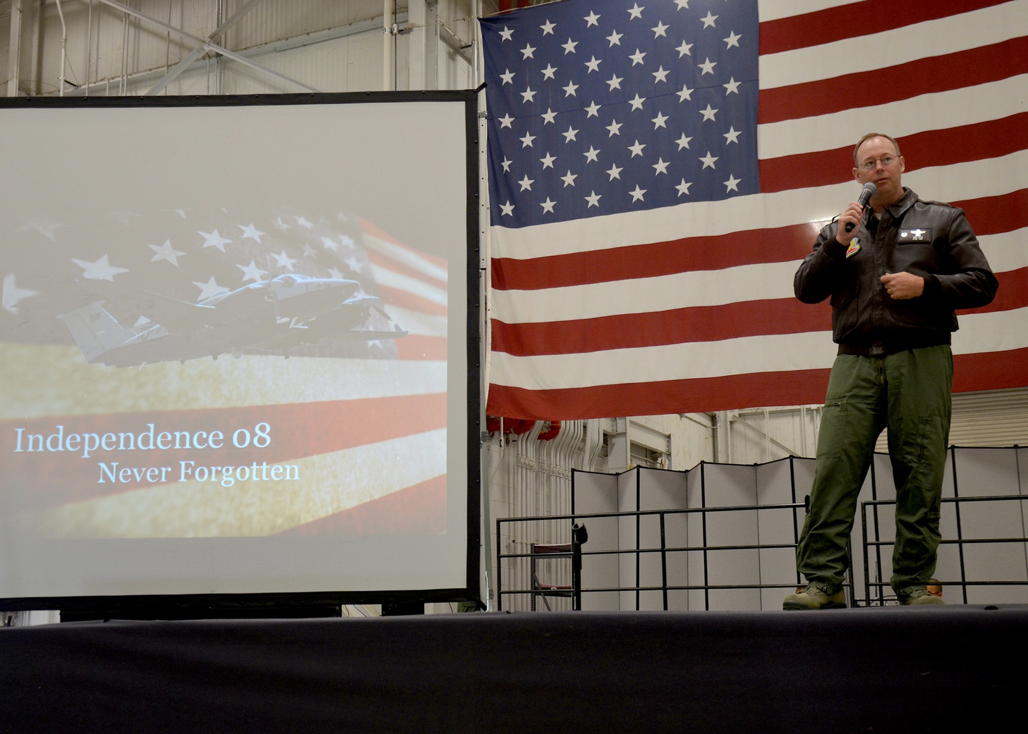 Lt. Col. David Berg, 427th Reconnaissance Squadron commander, speaks during a memorial service honoring four Airmen at Beale Air Force Base, Calif., April 25, 2014. The Airmen were killed when their MC-12 liberty crashed in Afghanistan in April 2013. (U.S. Air Force photo by 2nd Lt. Siobhan Bennett/Released)         
