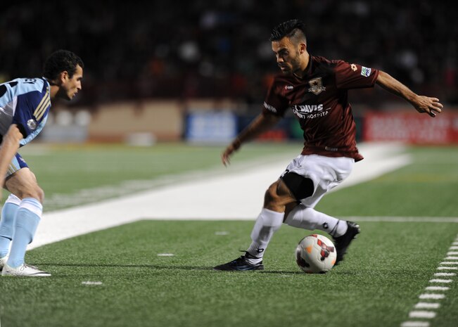 Sacramento Republic FC defender Jack Avesyan dribbles the ball during the team’s inaugural home game at Hughes Stadium in Sacramento, Calif., April 26, 2014. The newly formed team is a part of the United Soccer Leagues’ Men’s Professional Soccer. (U.S. Air Force photo by Staff Sgt. Robert M. Trujillo/Released)