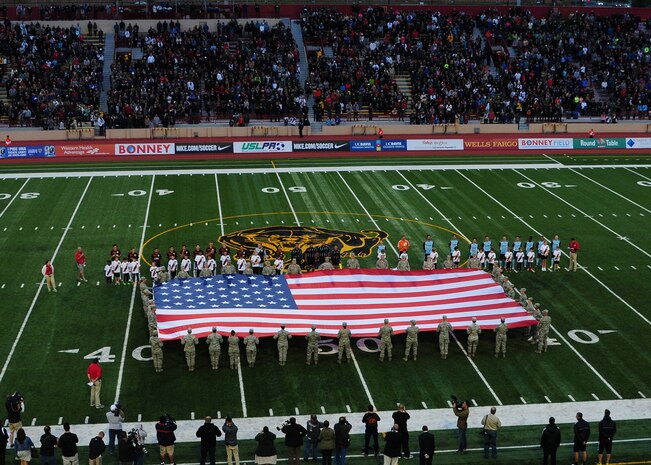 Airmen from Beale and Travis Air Force Bases, present the colors during the opening ceremonies of the inaugural Sacramento Republic FC home game at Hughes Stadium in Sacramento, Calif., April 26, 2014. The Republic vs. Harrisburg City Islanders match-up drew a USL Pro Soccer game regular-season record of 20,231 fans. (U.S. Air Force photo by Senior Airman Allen Pollard/Released)