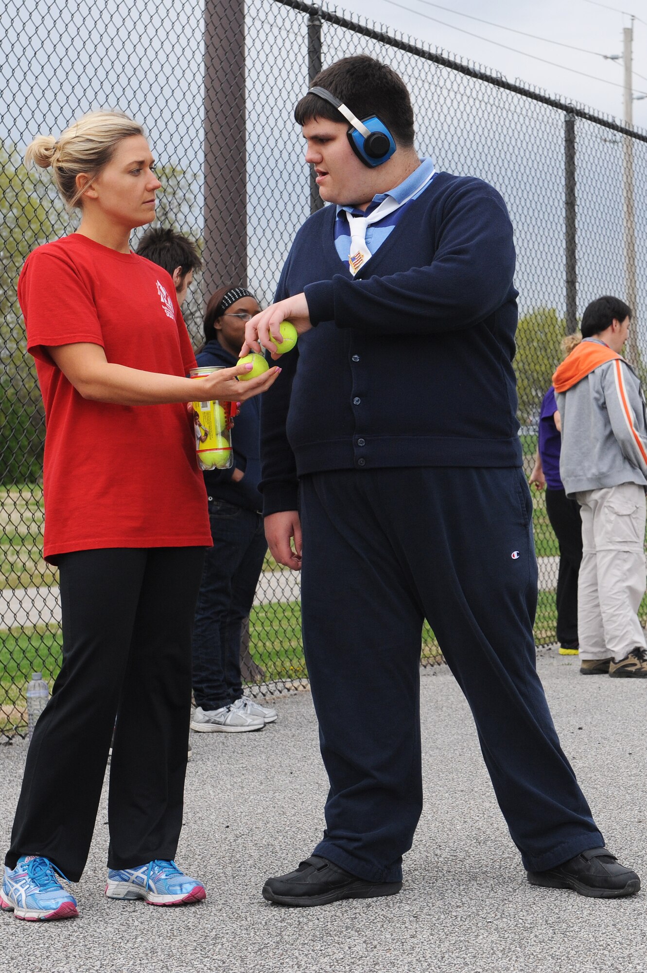 Kayce Beatty volunteers to train people with special needs, and hone their athletic skills at Scott Air Force Base, Ill., April 23, 2014.  The athletes competed in the Special Olympics April 26 at Southern Illinois University Edwardsville.  The categories some of the athletes participated in included a ball throw, standing long jump, 50 or 100 meter walk or run.  (U.S. Air Force photo by Staff Sgt. Maria Bowman)
