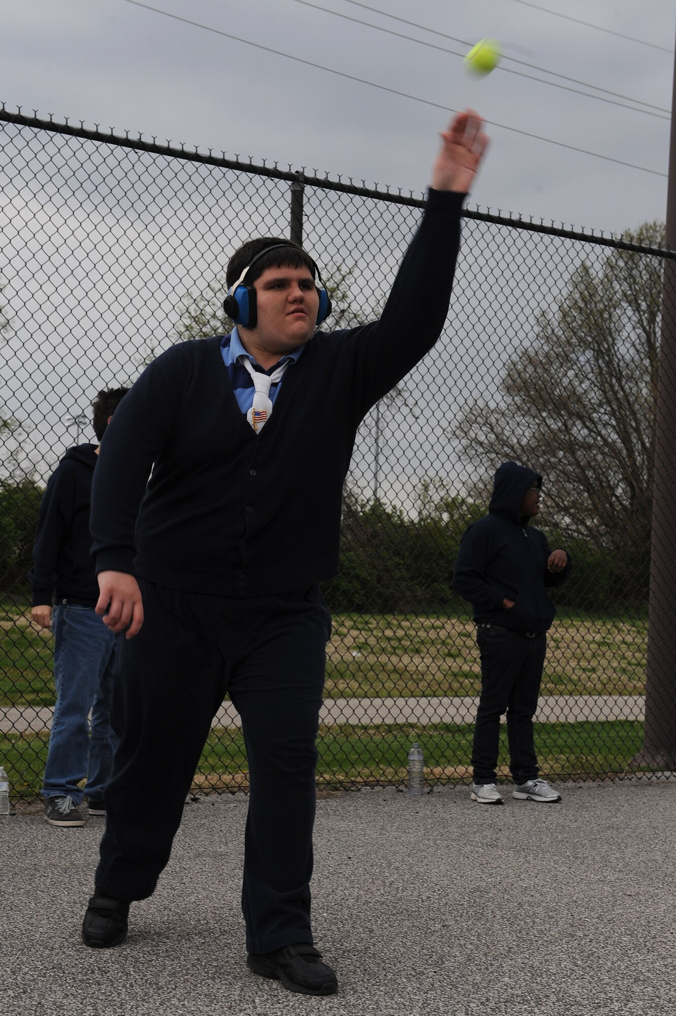 Jimmy Howe works to perfect his ball throwing skills at Scott Air Force Base, Ill., April 23, 2014.  Howe competed in a walking challenge and a ball-throwing competition at the Special Olympics, which were held at Southern Illinois University Edwardsville, April 26.  The goal of the ball competition is to toss a ball further than other participants.  (U.S. Air Force photo by Staff Sgt. Maria Bowman)