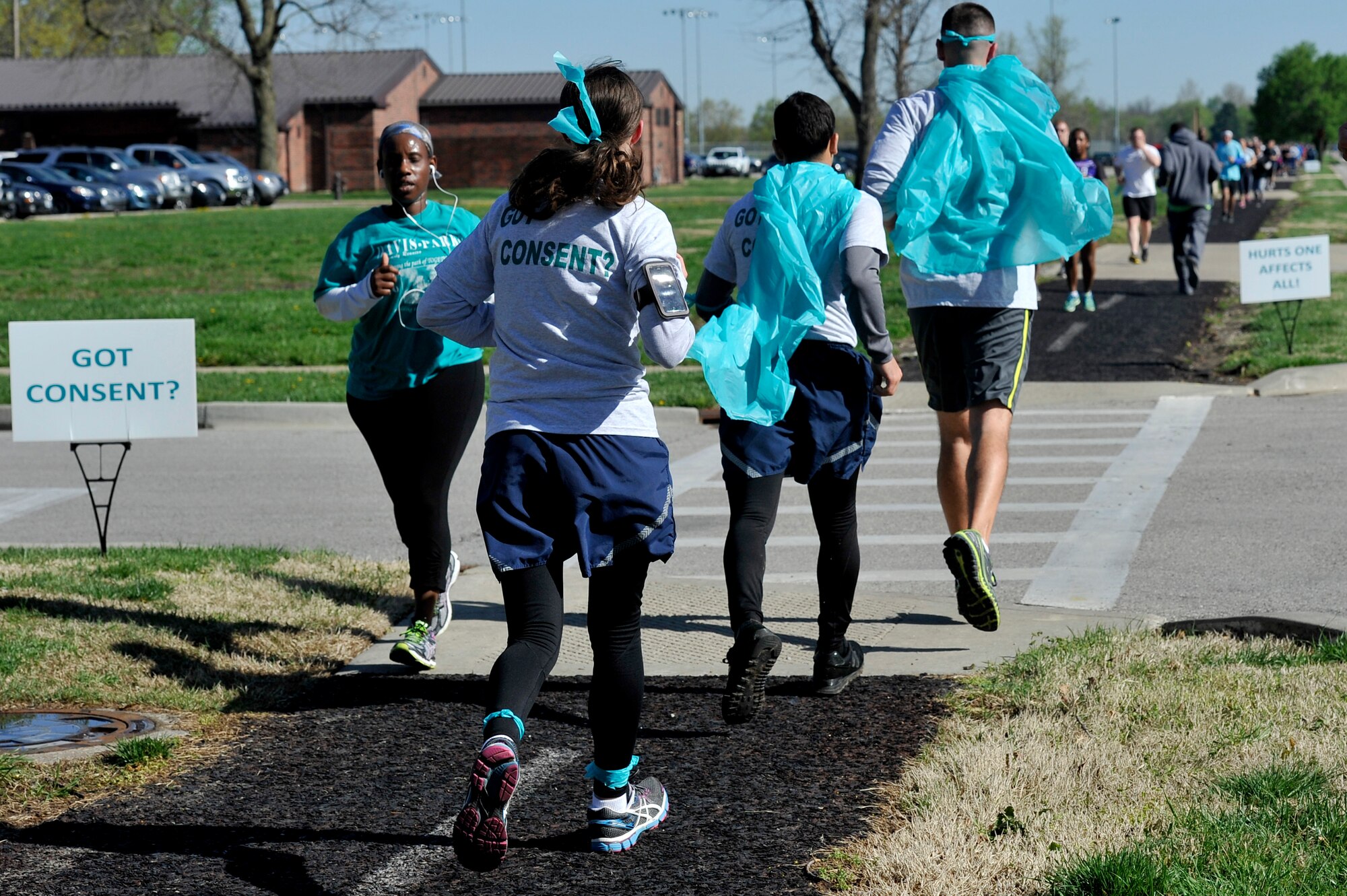 The 325 participants began the 5k run April 25, 2014 at Scott Air Force Base, Ill. Some participants wore the color teal to represent sexual assault awareness and prevention. Medals were also given to fastest female and male, first participant to show up, youngest participant, and many more. "Not only did units show up in full teal force, their commanders were right there with them," said 1st Lt. Danielle Duso, the deputy Sexual Assault Response Coordinator. (U.S. Air Force photo/ Airman 1st Class Kiana Brothers)