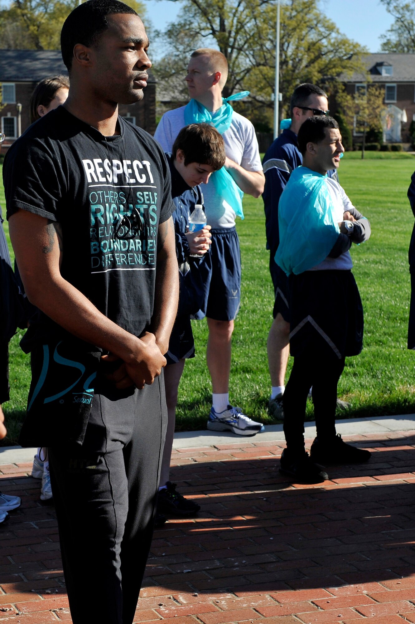 Individuals sported their teal during a 5k run April 25, 2014 at Scott Air Force Base, Ill. The color teal represents sexual assault awareness and prevention. A 5k run was held to help raise awareness and build comradery around the base. Master Sgt. Pamela King hosted this event and there were 325 participants. (U.S. Air Force photo/ Airman 1st Class Kiana Brothers)