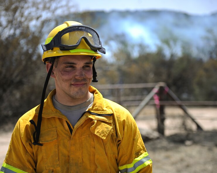 U.S. Air Force Airman 1st Class Richard Thomas, 7th Civil Engineer Squadron firefighter, assisted with the containment of a 1,600 acre wildfire April 28, 2014, near Buffalo Gap, Texas. Seven Dyess firefighters along with numerous other firefighters from the surrounding Big Country region responded to the blaze. (U.S. Air Force photo by Airman 1st Class Kedesha Pennant/Released)