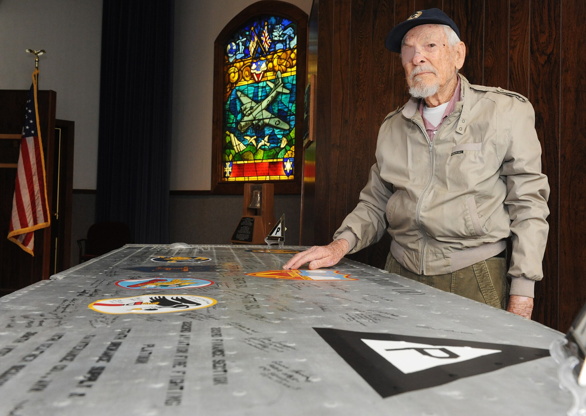 Olen Grant, 91, stands next to the wing panel of an old B-17 bomber that his unit, the 384th Bomber Group, flew during World War II. The 384th Bomber Group Inc., the official veteran’s association for the 384th, owns the panel and is shipping it around the country in an attempt to get signatures from the unit’s surviving members. (U.S. Air Force photo by Alex Lloyd)