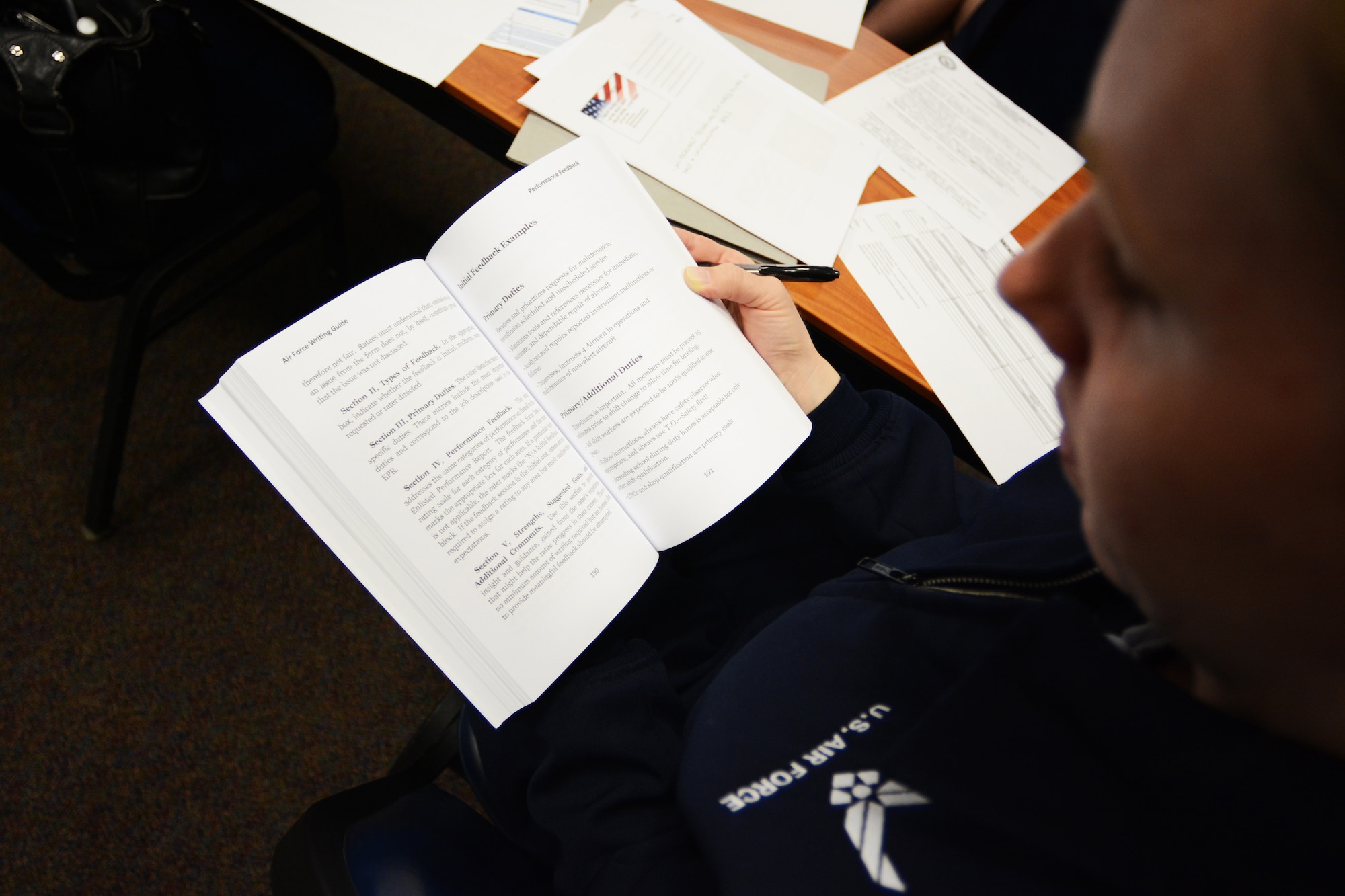 Tech. Sgt. Dawn Putzke, 128th Civil Engineering Squadron, reads through the Air Force Writing Guide during one of the State Enlisted Development Program classes at Volk Field Air National Guard Base, Wis., April 24, 2014. Dawn was one of 21 participants to complete the inaugural course. (Air National Guard photo by Senior Airman Andrea F. Liechti)