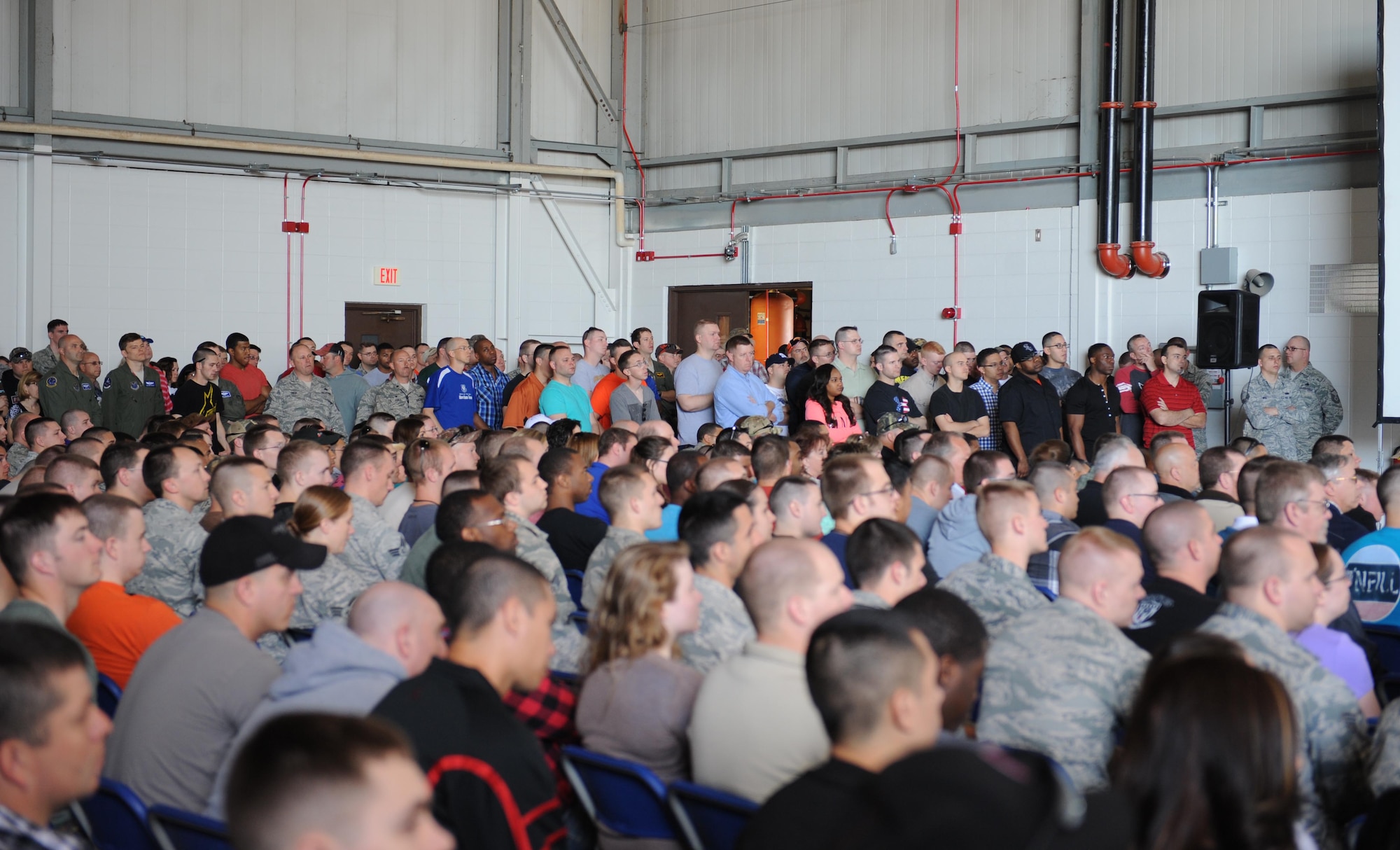 Members of team Whiteman listen during s commander’s call at Whiteman Air Force Base, Mo., April 25, 2014. Following the commander’s call, members broke off into small group discussions led by trained unit facilitators. The discussions encouraged groups to engage in conversation and help individuals better understand how sexual offenders operate and how to prevent possible assaults. (U.S. Air Force photo by Airman 1st Class Joel Pfiester/Released)