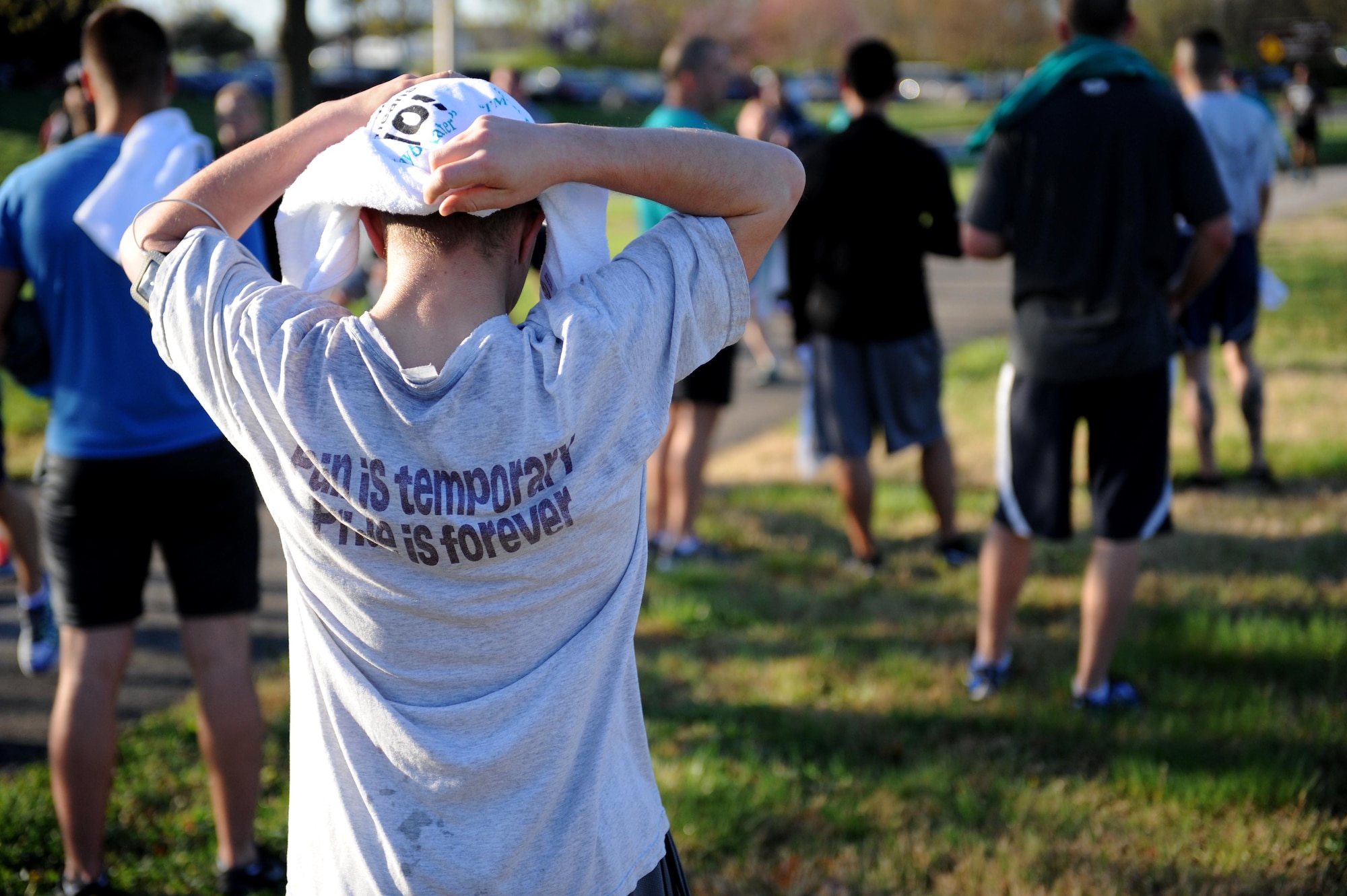 A runner catches his breath after completing the 5K Race for Respect April 25, 2014 at Whiteman Air Force Base, Mo. The race was the first event during the Sexual Assault Prevention and Response down-day, which focuses on helping victims of sexual assault cope, recognizing negative behaviors offenders might have, and how to create positive and productive work environments. (U.S. Air Force photo by Airman 1st Class Joel Pfiester/Released)
