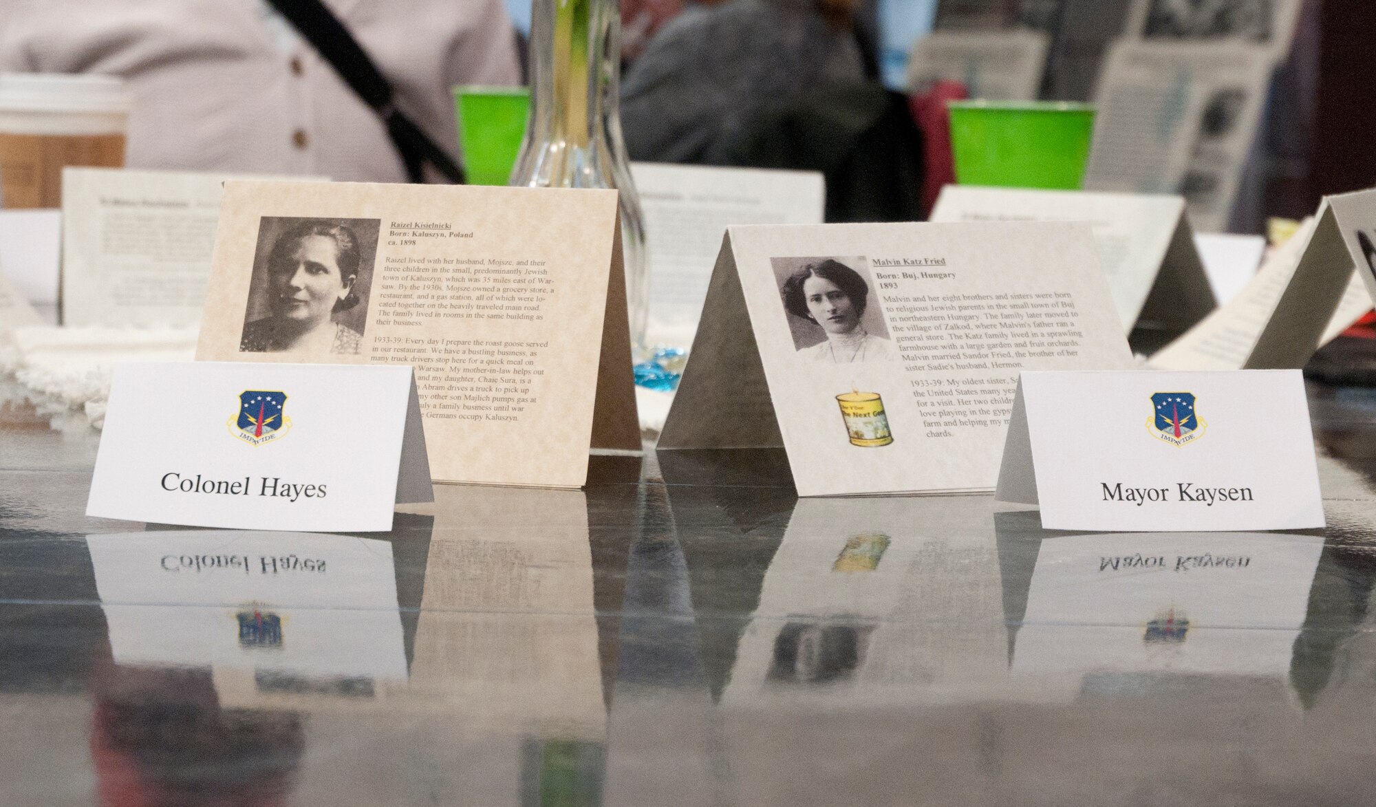 Col. Tracy Hayes, 90th Missile Wing commander, and Cheyenne Mayor Rick Kaysen’s name tags are displayed in front of the name tags of Holocaust survivors April 29 in the Fall Hall Community Center. Name tags of different survivors and victims of the Holocaust were placed at every table during the event. (U.S. Air Force photo by Airman Malcolm Mayfield)