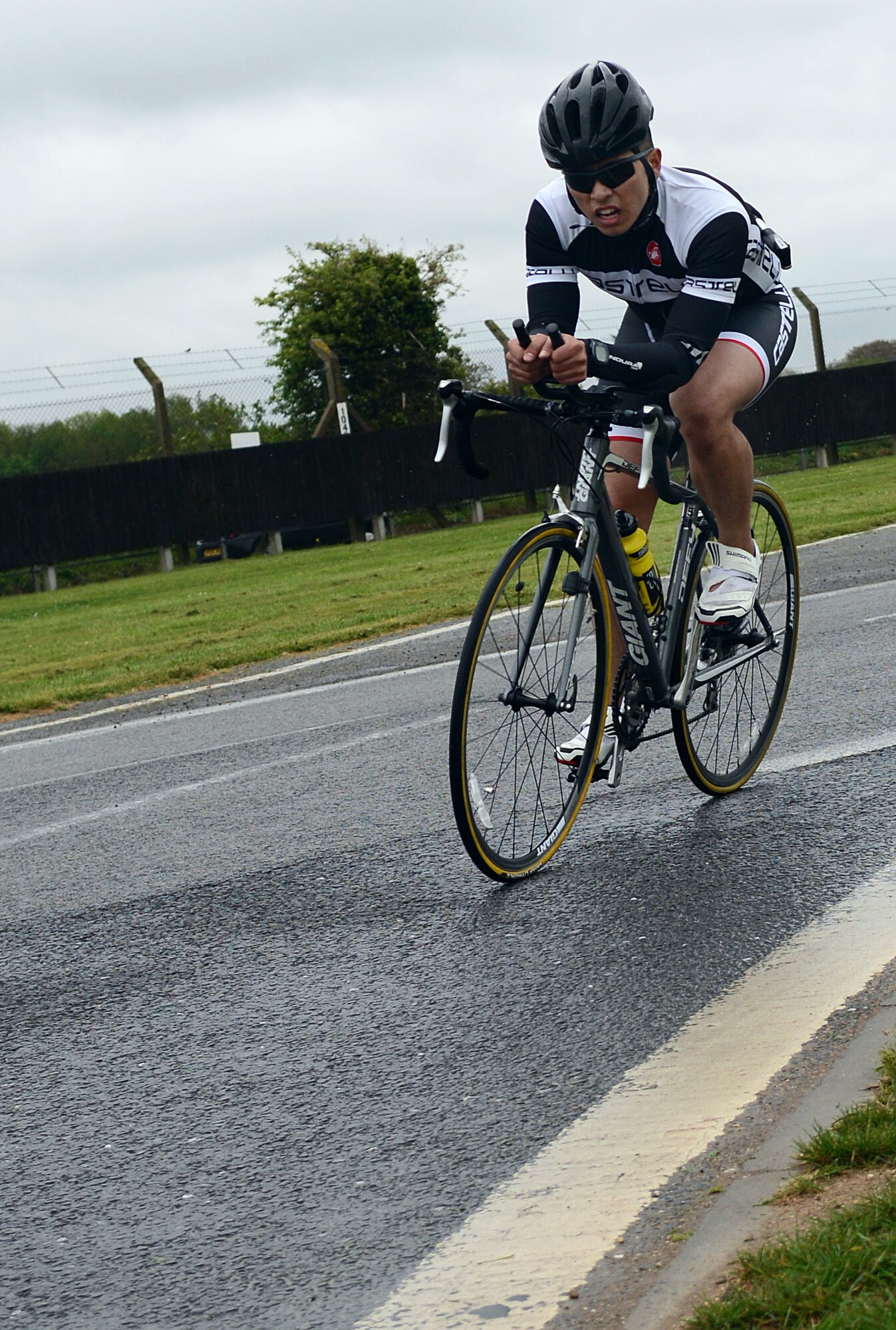 U.S. Air Force Airman 1st Class Brain Magkasi, 100th Civil Engineer Squadron power production journeyman from Great Mills, Md., competes in the 100th Force Support Squadron’s duathlon April 26, 2014, on RAF Mildenhall, England. The event consisted of running two miles, biking approximately 20 miles and then running another two miles. The duathlon is one of the five incentive fitness programs the 100th FSS hosts throughout the year. (U.S. Air Force photo by Airman 1st Class Jonathan Light/Released)