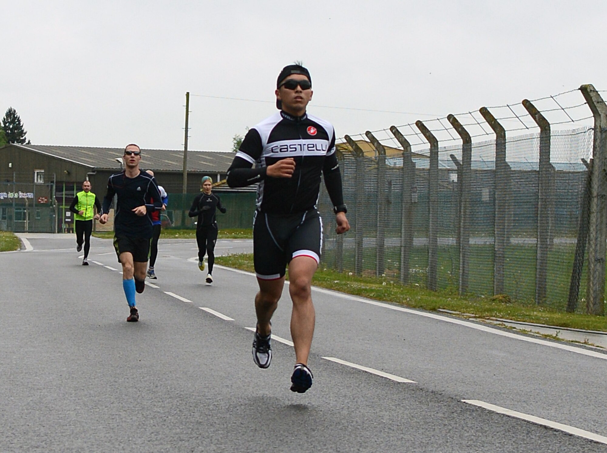 Team Mildenhall members race to complete the first portion of the 100th Force Support Squadron’s duathlon April 26, 2014, on RAF Mildenhall, England. The duathlon is one of the five incentive fitness programs the 100th FSS hosts throughout the year. (U.S. Air Force photo by Airman 1st Class Jonathan Light/Released)