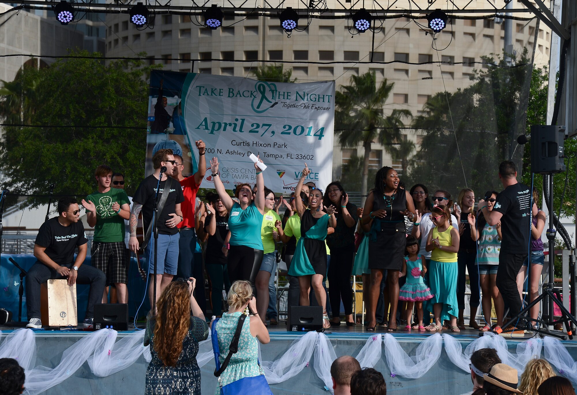 Members of the Tampa Bay community sing during the Sexual Violence Task Force of Tampa Bay’s, in collaboration with the Crisis Center of Tampa Bay, “Take Back the Night” event at Curtis Hixon Park in Tampa, Fla., April 27, 2014. The event was put on to create awareness, empower survivors and educate the community about sexual violence. (U.S. Air Force photo by Airman 1st Class Vernon L. Fowler Jr./Released)