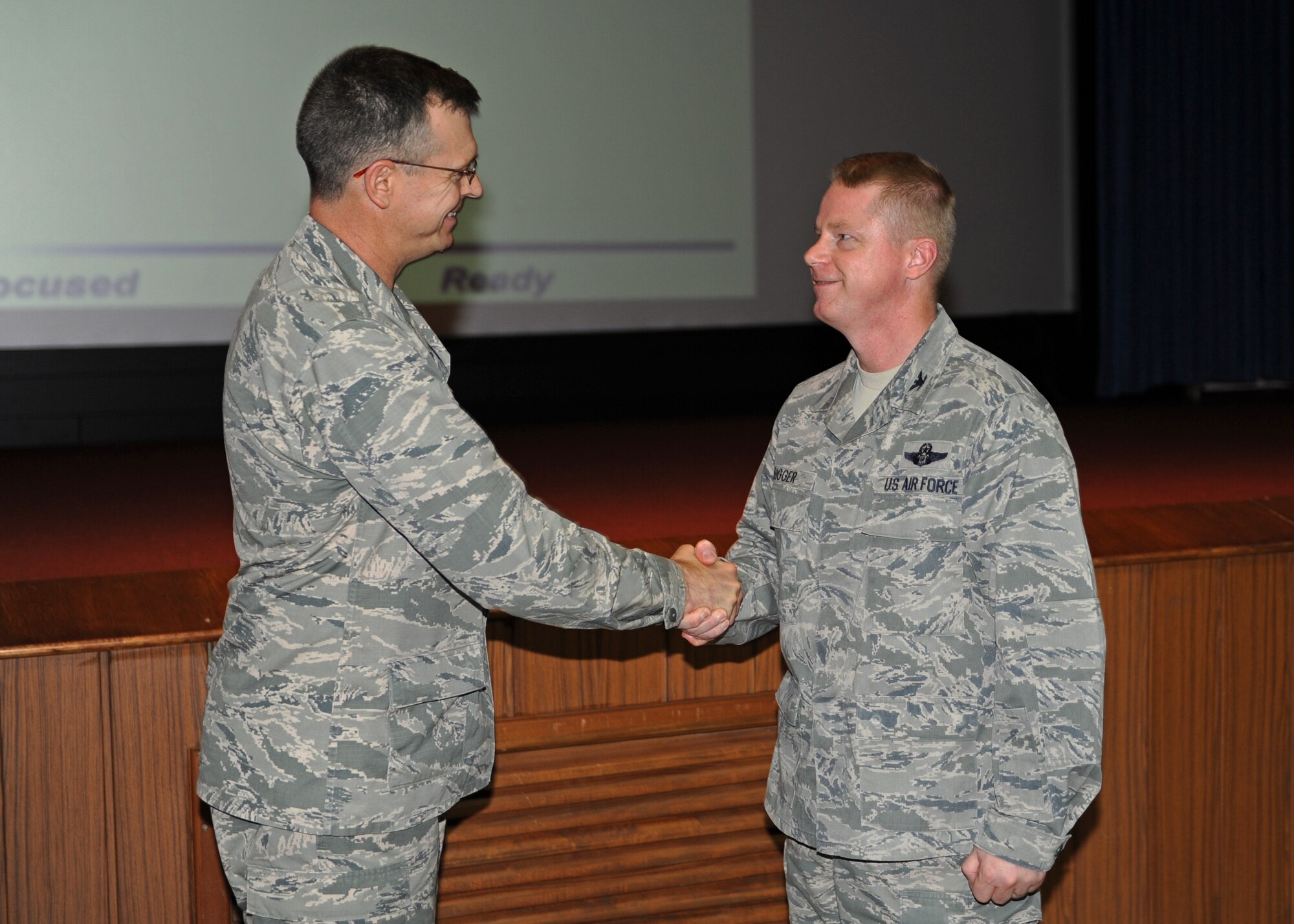 Col. Brent Bigger, 39th Air Base Wing vice commander, is awarded the "Pick of the 'Lik" for the week of April 23, 2014, Incirlik Air Base, Turkey. The 39th Air Base Wing leadership recognizes Airmen for demonstrating outstanding leadership and job performance abilities. (U.S. Air Force photo by Senior Airman Chase Hedrick/Released)