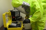 Senior Airman Trevaughn Sheppard, 559th Aerospace Medicine Squadron, uses a HAZMAT ID for qualitative material analysis, and a MultiRae, multi-gas monitor for confined space applications, to perform a biological test during the Joint Base San Antonio-Randolph CBRN Challenge April 23. (U.S. Air Force photo by Joel Martinez)

