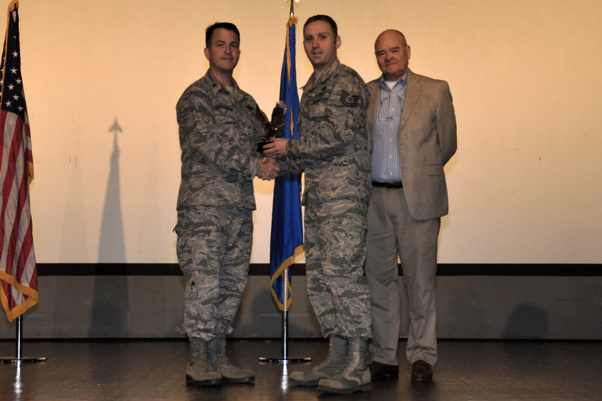 Tech. Sgt. George Potzgo, 916th Force Support Squadron, is recognized as Junior Civilian of the Year by Col. Craig Shenkenberg, 916th Air Refueling Wing vice-commander, and Dr. Mike Gooden, 916th Air Refueling Wing honorary commander. All 2013 yearly and fourth quarterly award winners were recognized during the April drill weekend. (U.S. Air Force photo/Staff Sgt. Alan Abernethy)
