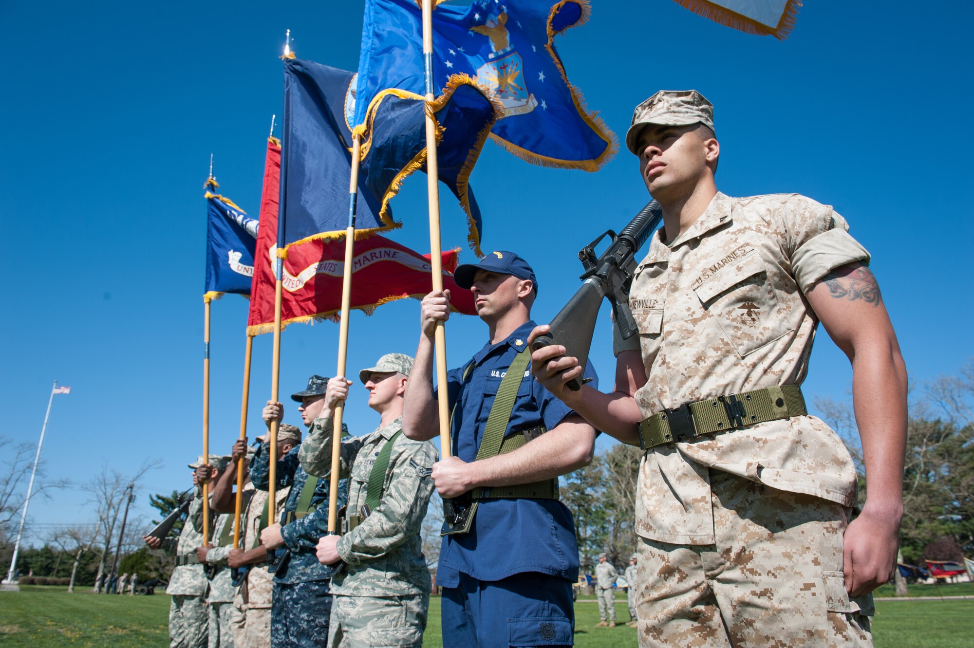 Members of the Joint Base McGuire-Dix-Lakehurst, N.J., color guard, take position at a Retreat Ceremony Apr. 24, 2014, at JB MDL. All five branches took part in the cannon firing and lowering of the flag at Sharpe Field. (U.S. Air Force photo by Russ Meseroll/Released)