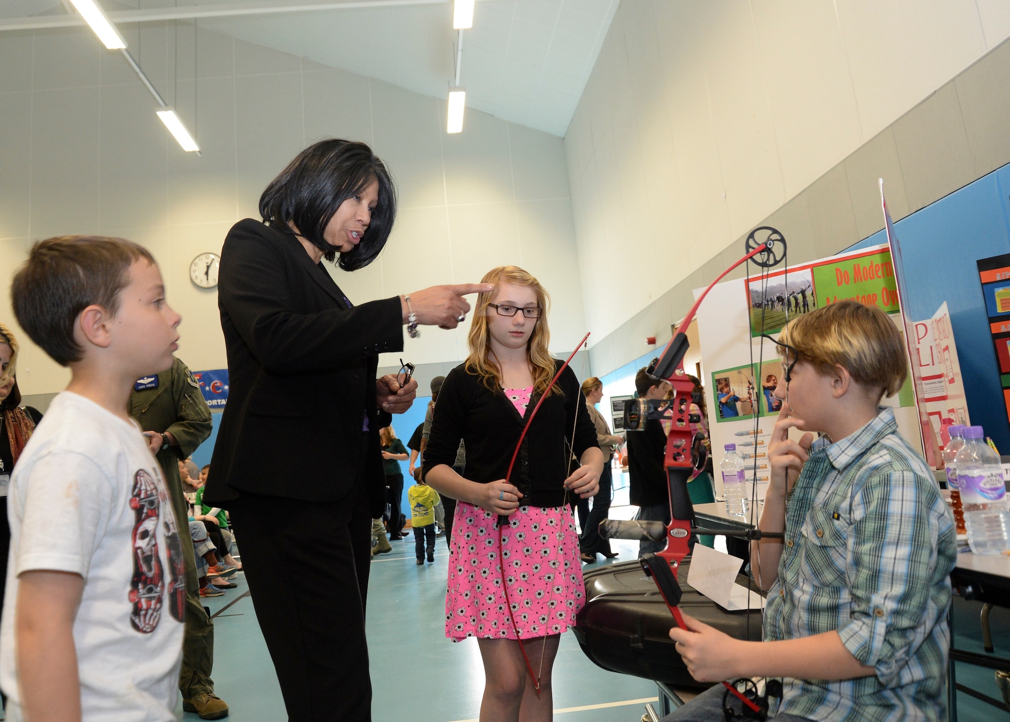 Lakenheath Middle School Principal Gloria Hajat visits students participating in the LMS science fair on Royal Air Force Feltwell, England, April. 28, 2014. Students manned mare than 37 experiments as a fundraiser for a lock-in social. (U.S. Air Force photo by Airman 1st Class Nigel Sandridge/Released) 