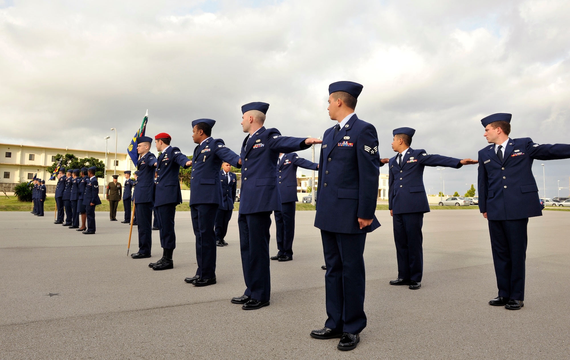 Students of the Airman Leadership School Class 14-D perform "dress right, dress" during a service dress uniform inspection on Kadena Air Base, Japan, April 29, 2014. The Erwin Professional Military Education Center provides professional military education to approximately 385 senior airmen every year to prepare them for leading and managing Airmen within their units. (U.S. Air Force photo by Naoto Anazawa)