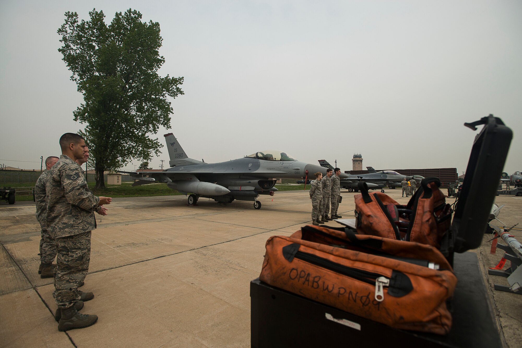 Teams standby before the start of the 2014 Korean Peninsula Weapons Loading Competition April 26, at Osan Air Base, Republic of Korea. Four teams from Osan and Kunsan AB competed for the title of best weapons load crew in the country. (U.S. Air Force photo by Staff Sgt. Jake Barreiro)