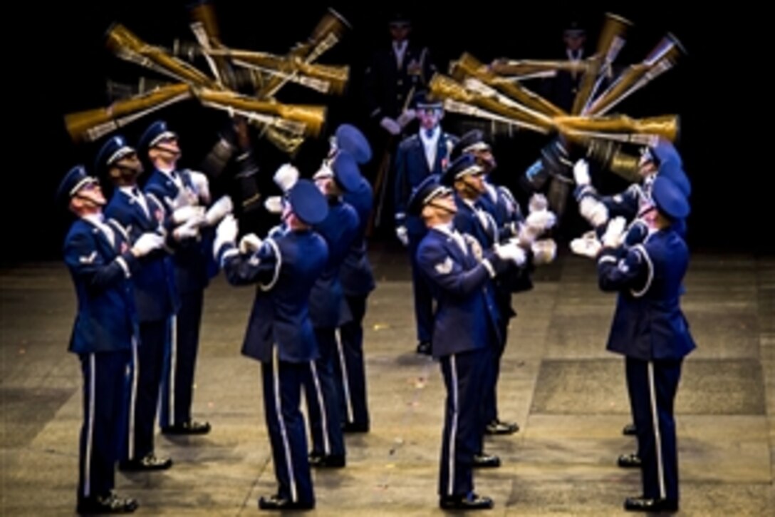 The U.S. Air Force Honor Guard Drill Team performs during the 2014 Virginia International Tattoo at the Scope Arena in Norfolk, Va., April 26, 2014. The annual festival highlights military bands and performers from around the world to honor Vietnam veterans and their families.
