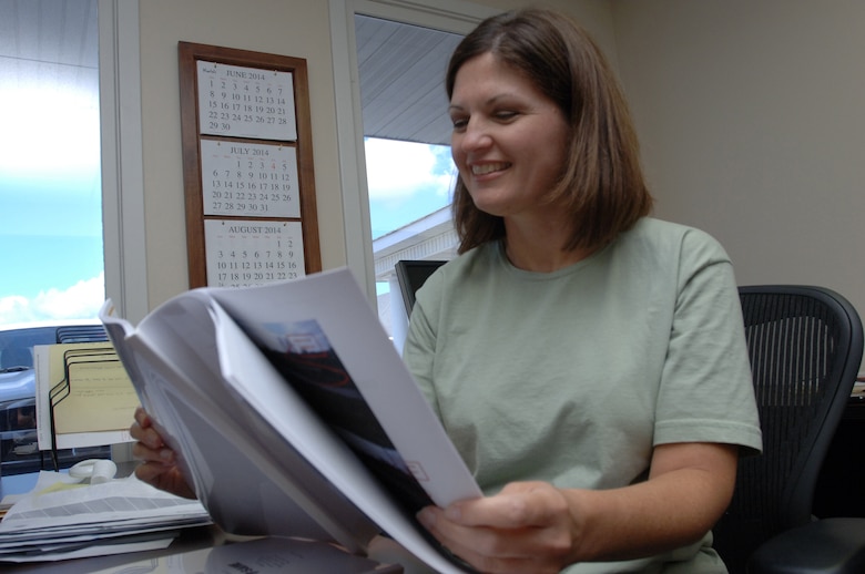 Marla Marshall, administrative assistant at the U.S. Army Corps of Engineers Nashville District Western Regulatory Field Office in Decatur, Ala., works at her desk at the office July 29, 2014.
