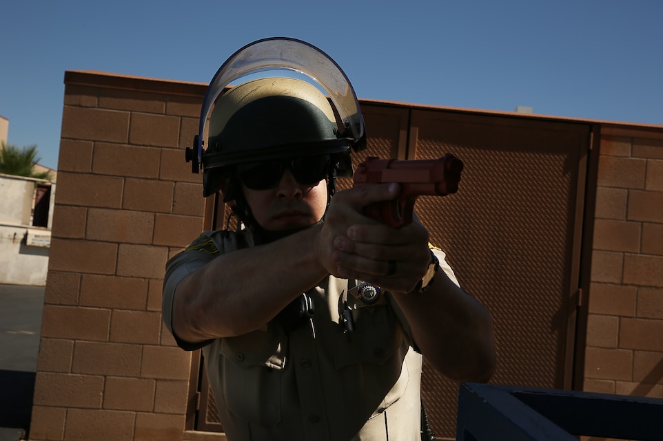 Ramon Lomeli, deputy sheriff, San Bernandino County Sheriff’s Department, provides security on an outdoor classroom while a team of police officers with the sheriff’s department prepare to clear the inside during an active shooter exercise at Condor Elementary School, July 22, 2014.