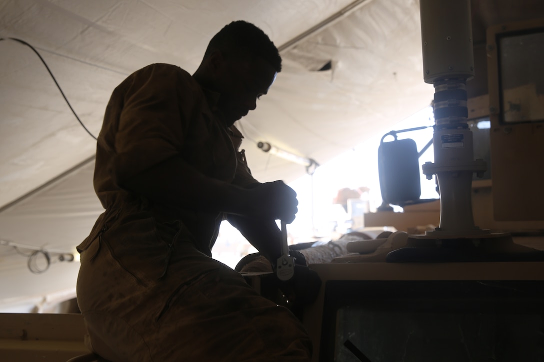 Lance Cpl. Romario Penny, a motor transportation mechanic with 1st Battalion, 7th Marine Regiment, removes bolts from a Mine-Resistant Ambush Protected vehicle in order to replace a broken window aboard Camp Leatherneck, Afghanistan, July 22, 2014. Penny, a native of DeKalb County, Ga., and four other lance corporals are the five mechanics responsible for all maintenance performed on vehicles in the battalion to ensure mission success during combat operations.
(U.S. Marine Corps photo by Cpl. Joseph Scanlan / released)
