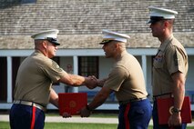 Master Sgt. Jeffery Loeffler shakes hands with Maj. Christopher Tsirlis, Commanding Officer of Marine Corps Recruiting Station Twin Cities, during his retirement ceremony. Loeffler retired after having served in the Marine Corps for 27 years. Loeffler spent 15 of those 27 years in Marine Corps Recruiting Station Twin Cities. The ceremony took place July 31 aboard Historic Fort Snelling. 