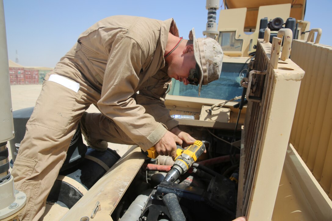 Lance Cpl. Andrew Witte, a motor transportation mechanic with 1st Battalion, 7th Marine Regiment, performs maintenance on a Mine-Resistant Ambush Protected vehicle aboard Camp Leatherneck, Afghanistan, July 22, 2014. Witte, a native of Phoenix, and four other lance corporals are the five mechanics responsible for all maintenance performed on vehicles in the battalion to ensure mission success during combat operations.
(U.S. Marine Corps photo by Cpl. Joseph Scanlan / released)
