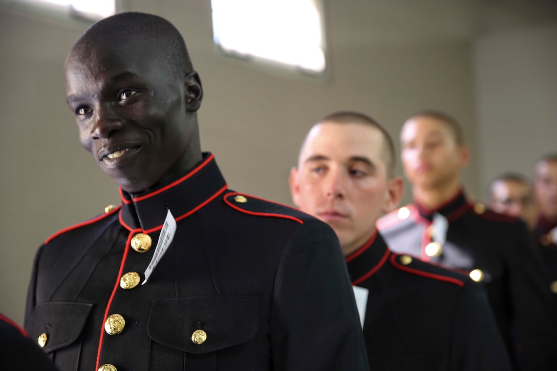 Recruit Ramadan A. Nagok, Platoon 3262, Mike Company, 3rd Recruit Training Battalion, waits to have his dress blue coat tailored at Marine Corps Recruit Depot San Diego, July 30. Nagok is a Kansas City, Mo., native and was recruited out of Recruiting Substation Gladstone, Mo.