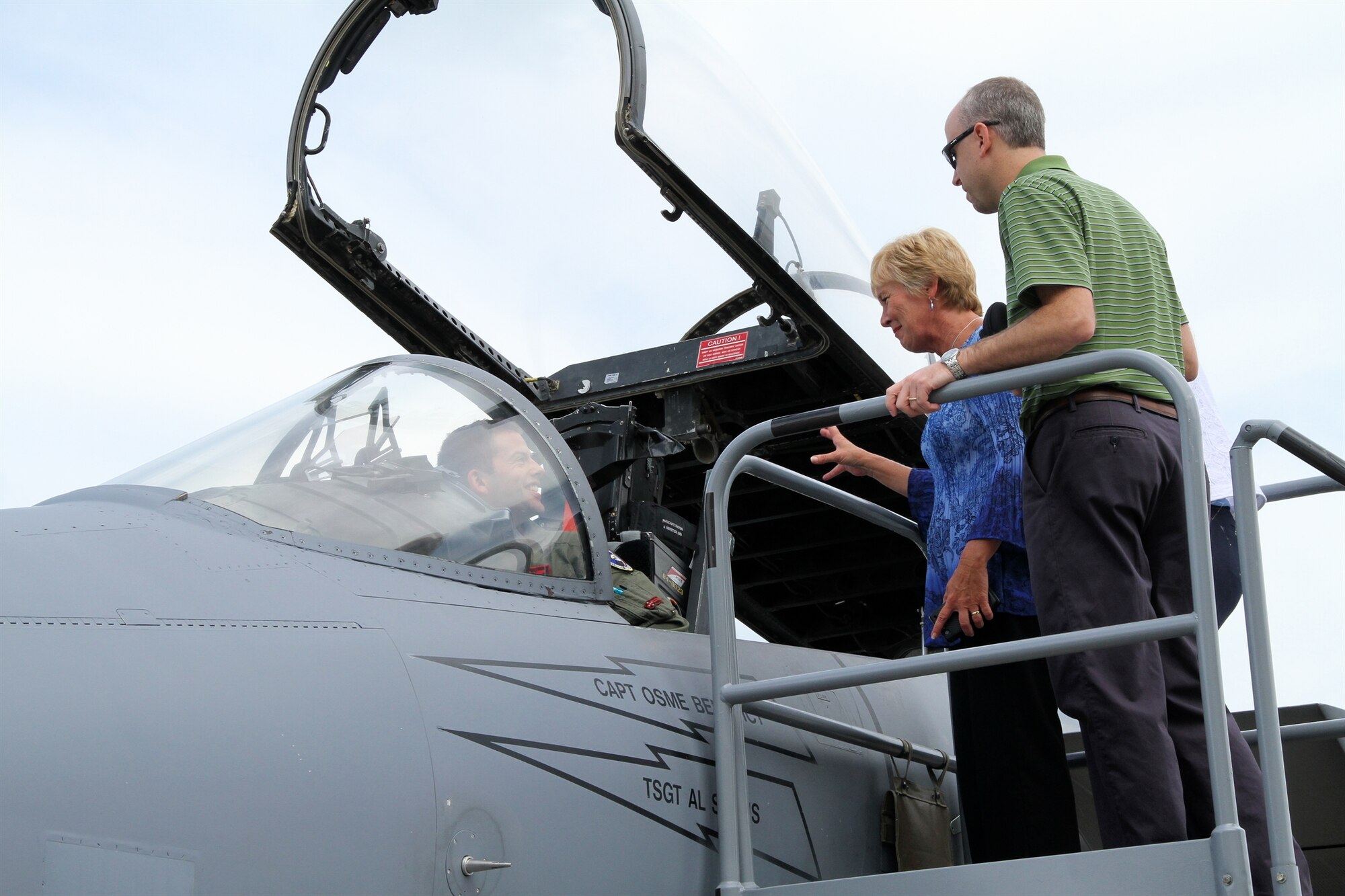 Barbara Bohman, chief of F-15 integration, and Jim Ehret, chief of F-15 contracts, discuss F-15 capabilities with Capt. Martin Clark of the 104th Operations Group, Barnes Air National Guard base. Bohman worked on the F-15 for 14 1/2 years. (Skywrighter photo by Kathy Tyler)
