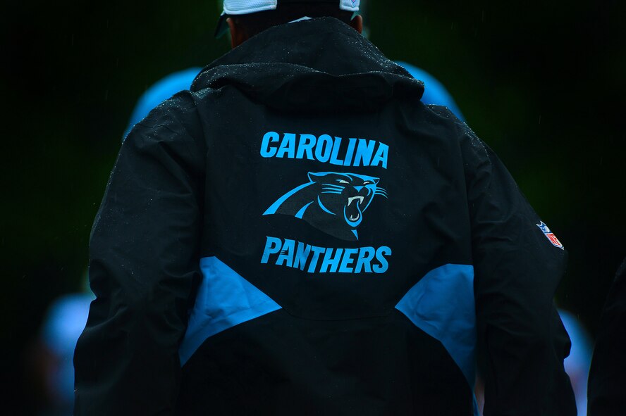 A Carolina Panthers team member stands on the sidelines during training camp in Spartanburg, S.C., July 30, 2014. Hosted by the United Services Organization North Carolina, five Team Shaw members were afforded the opportunity to spend the day at the Carolina Panthers training camp watching the team practice. (U.S. Air Force photo by Airman 1st Class Jensen Stidham/Released)
