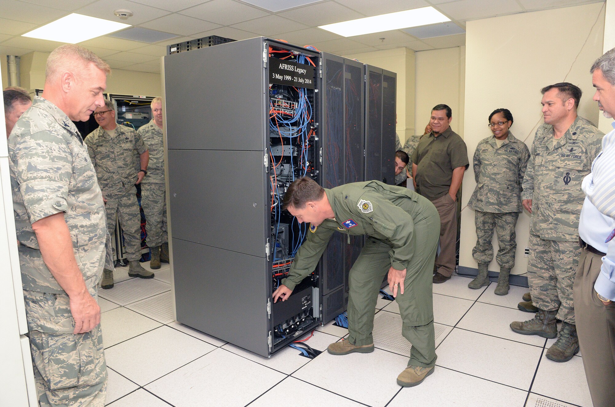 Brig. Gen. John P. Horner powers down the server supporting the Air Force Recruiting Information Support System – Legacy application at Headquarters Air Force Recruiting Service July 21. It was one of the last official acts for the commander, who was promoted to major general July 25 and is now the deputy director of the Defense Threat Reduction Agency at Fort Belvoir, Va. (U.S. Air Force photo/Johnny Saldivar)