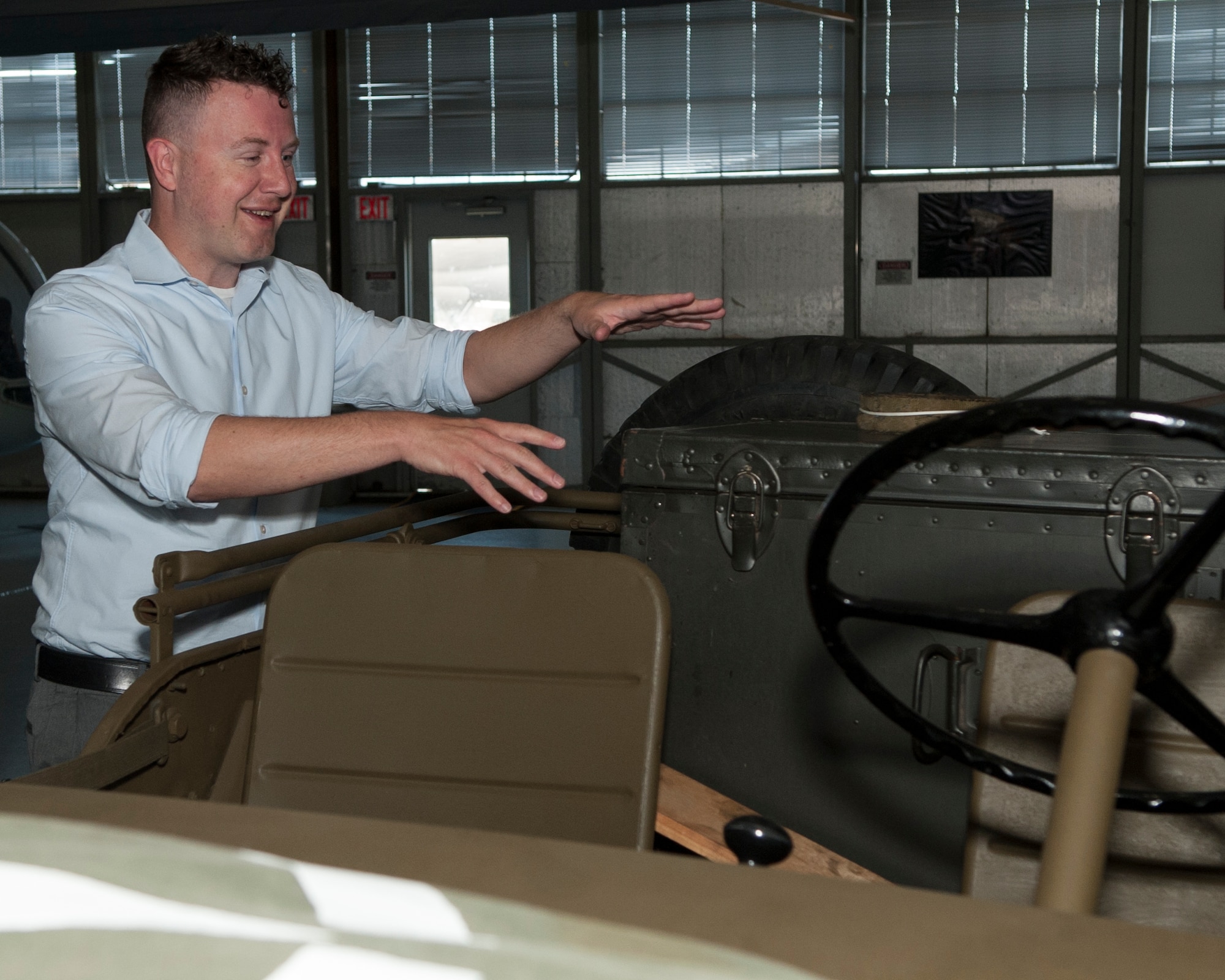 Dr. Andrew Wackerfuss, 436th Airlift Wing historian, examines a World War II era U.S. Army historian’s field kit July 29, 2014, at the Air Mobility Command Museum on Dover Air Force Base, Del. This field kit shows the enlisted lineage that the Air Force historians, who now comprise of mainly civilians, have transitioned from. (U.S. Air Force photo/Airman 1st Class Zachary Cacicia)