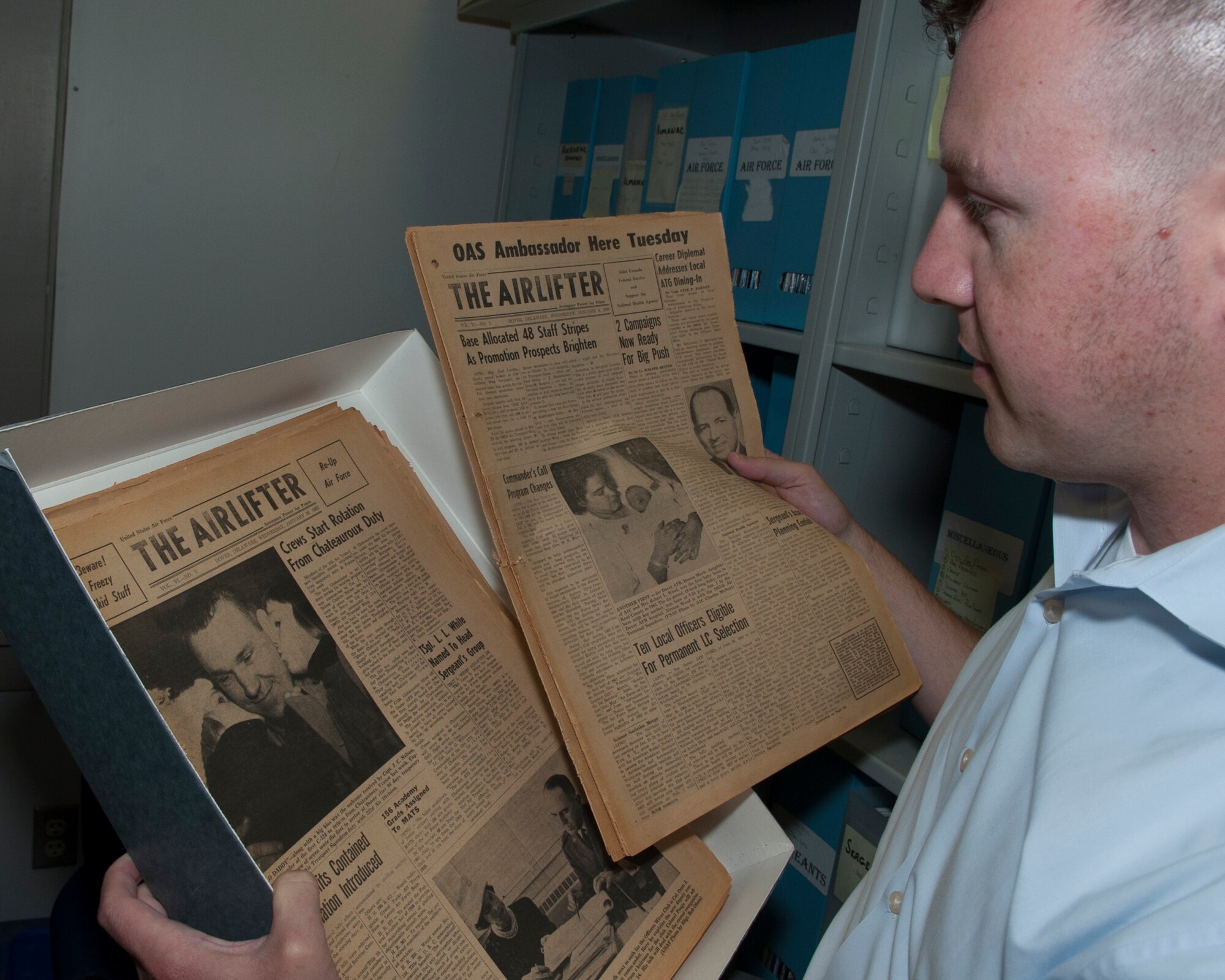 Dr. Andrew Wackerfuss, 436th Airlift Wing historian, sorts through issues of “The Airlifter” newspaper July 29, 2014, at the Air Mobility Command Museum on Dover Air Force Base, Del.Dr. Wackerfuss has been an Air Force historian since 2010 and has worked at Dover AFB since May, 2013. (U.S. Air Force photo/Airman 1st Class Zachary Cacicia)
