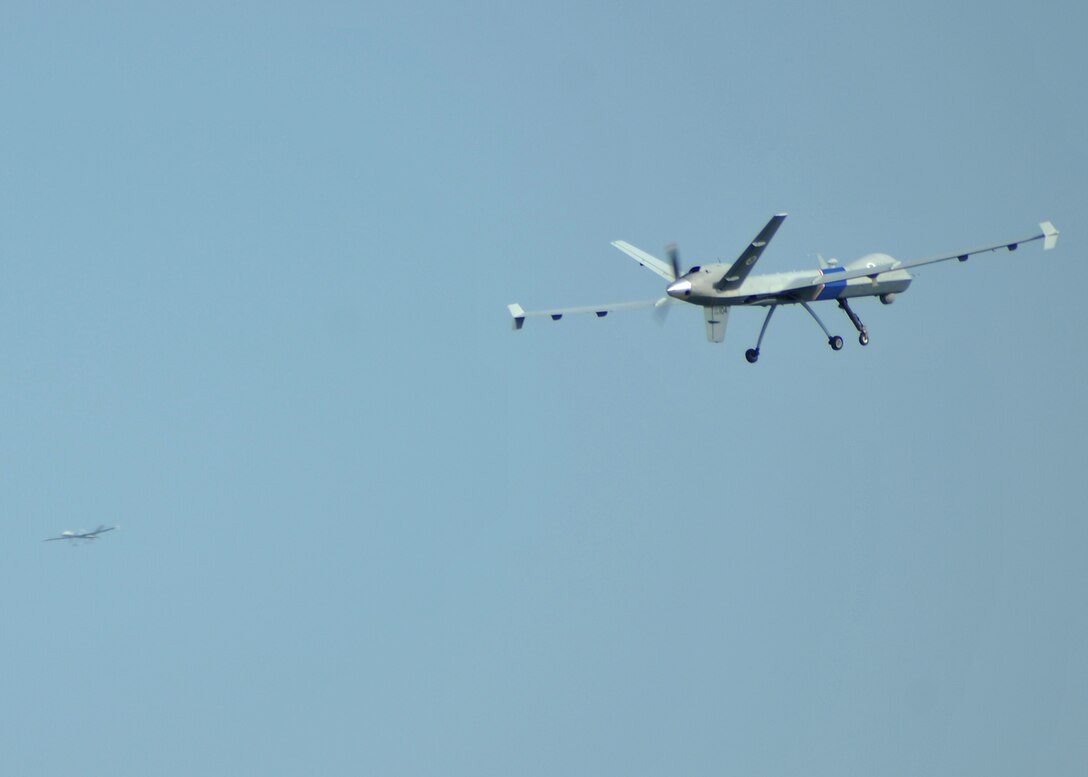 Two MQ-9 Predator Bs fly in a rectangular pattern above Grand Forks Air Force Base, Aug. 1, 2014. The two Predators are the first remotely piloted aircraft allowed by the Federal Aviation Administration to fly simultaneously in the same unrestricted airspace. (U.S. Air Force photo/Senior Airman Xavier Navarro)