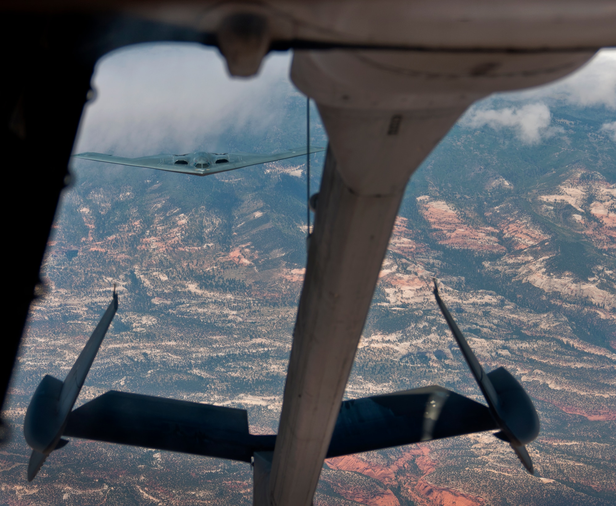A B-2 Spirit from Whiteman AFB, Mo., prepares to conduct an aerial refuel with a KC-10 Extender July 23, 2014. The B-2 Spirit is a multi-role bomber capable of delivering both conventional and nuclear munitions. A dramatic leap forward in technology, the bomber represents a major milestone in the U.S. bomber modernization program. The B-2 brings massive firepower to bear, in a short time, anywhere on the globe through previously impenetrable defenses. (U.S. Air Force photo by Senior Airman Charles Rivezzo)