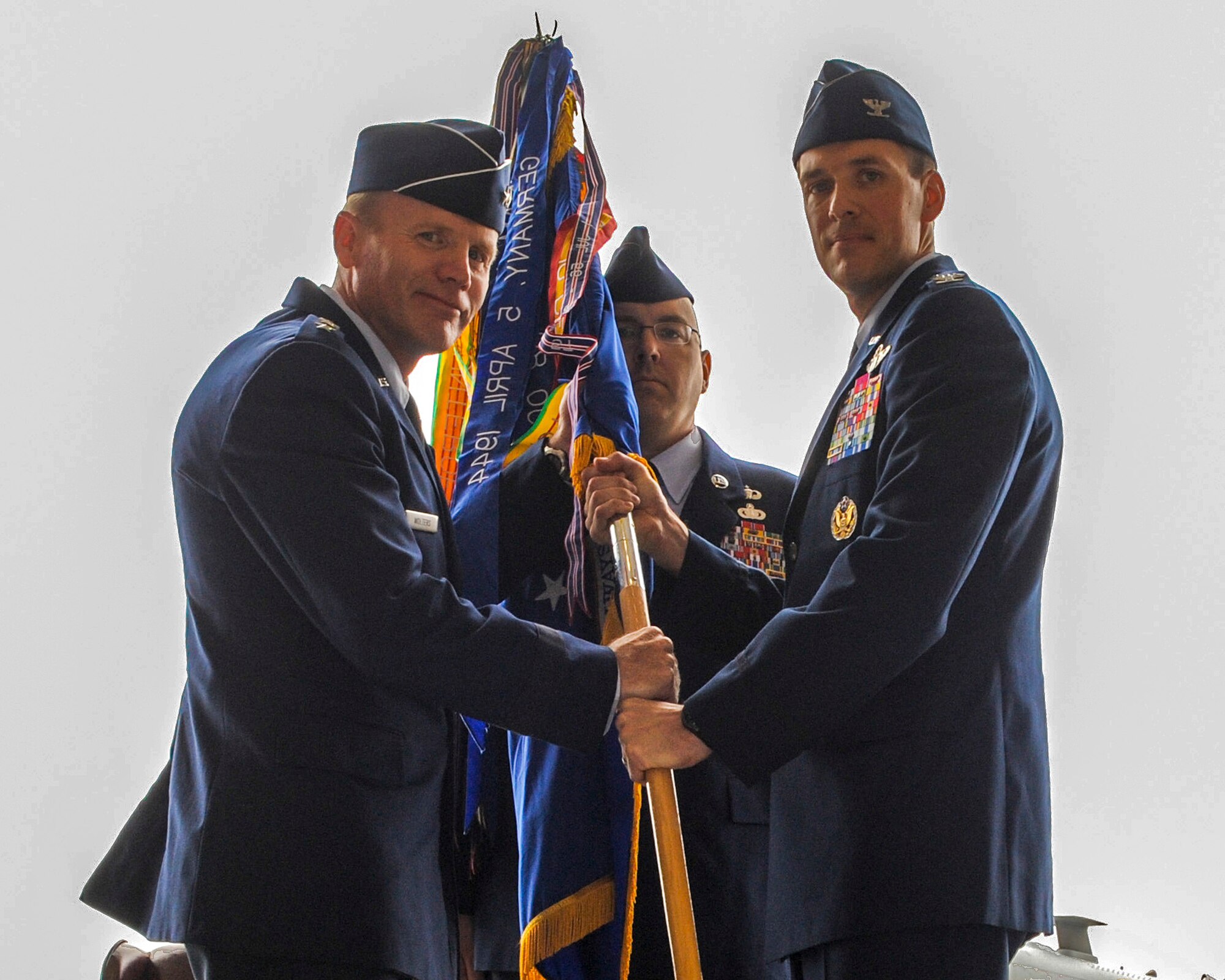 U.S. Air Force Col. James P. Meger receives the 355th Fighter Wing guidon from Lt. Gen. Tod D. Wolters, 12th Air Force (Air Forces Southern) commander, during a change of command ceremony at Davis-Monthan Air Force Base, Ariz., Aug. 1, 2014. Meger replaced Col. Kevin. E. Blanchard and is now responsible for one of the largest installations and flying operations in the United States Air Force, with more than 7,000 Airmen, 3,200 civilians, and more than 100 aircraft.  (U.S. Air Force Photo by Airman 1st Class Chris Drzazgowski/Released)