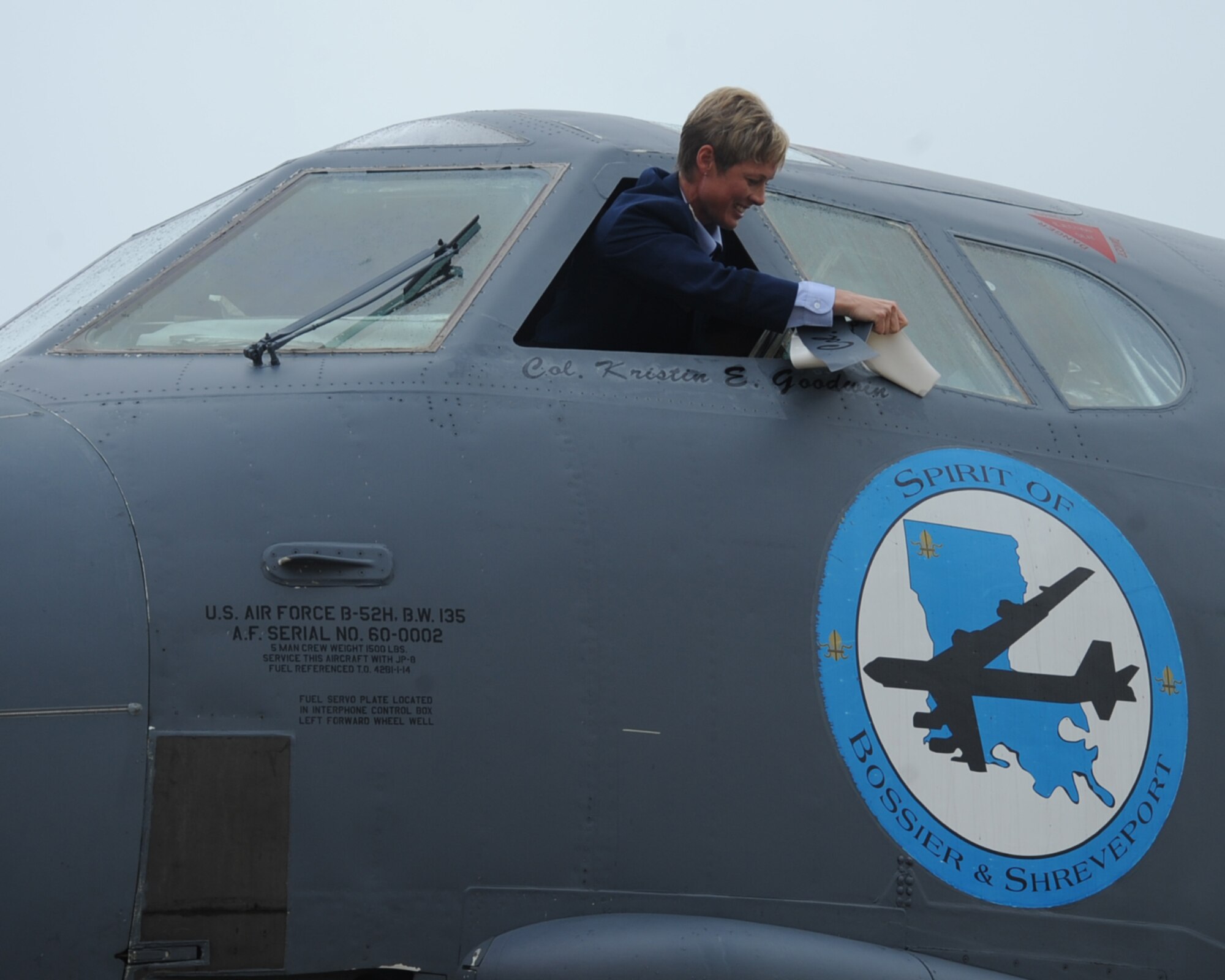 Col. Kristin Goodwin, 2nd Bomb Wing commander unveils her name from the 2nd BW's flagship B-52H Stratofortress after her change of command ceremony on Barksdale Air Force Base, La., Aug 1, 2014. Goodwin is a command pilot with more than 2,800 flying hours in the B-52, B-2, EC-130, C-130, T-38, T-1, T-37 (U.S Air Force photo/Staff Sgt. Sean Martin)


