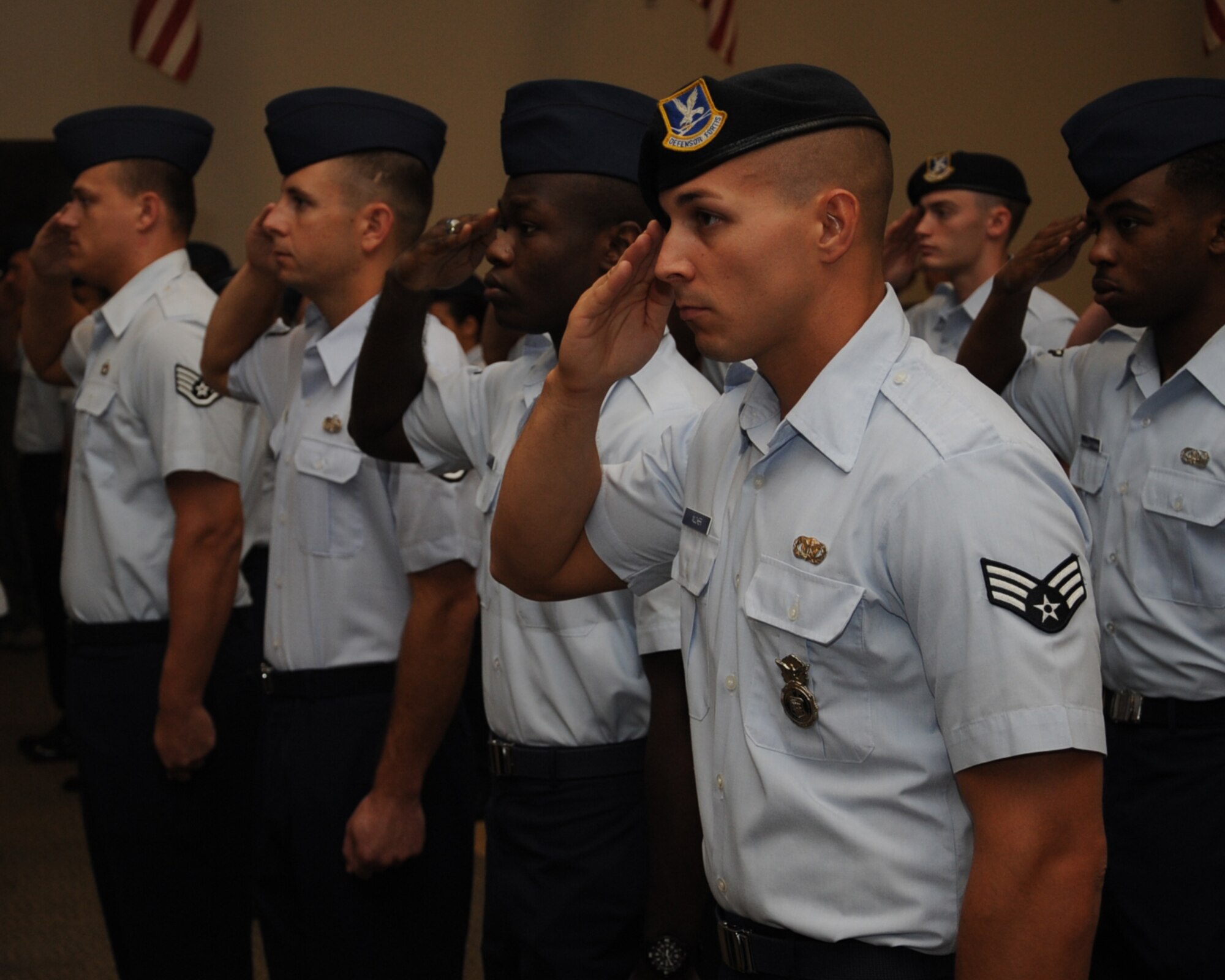 Airmen from the 2nd Mission Support Group salute during the 2nd Bomb Wing change of command ceremony on Barksdale Air Force Base, La., Aug. 1, 2014. Airmen participated in this ceremony as a final send-off to their outgoing commander and as a warm welcome to their incoming commander. (U.S Air Force photo/Staff Sgt. Sean Martin)


