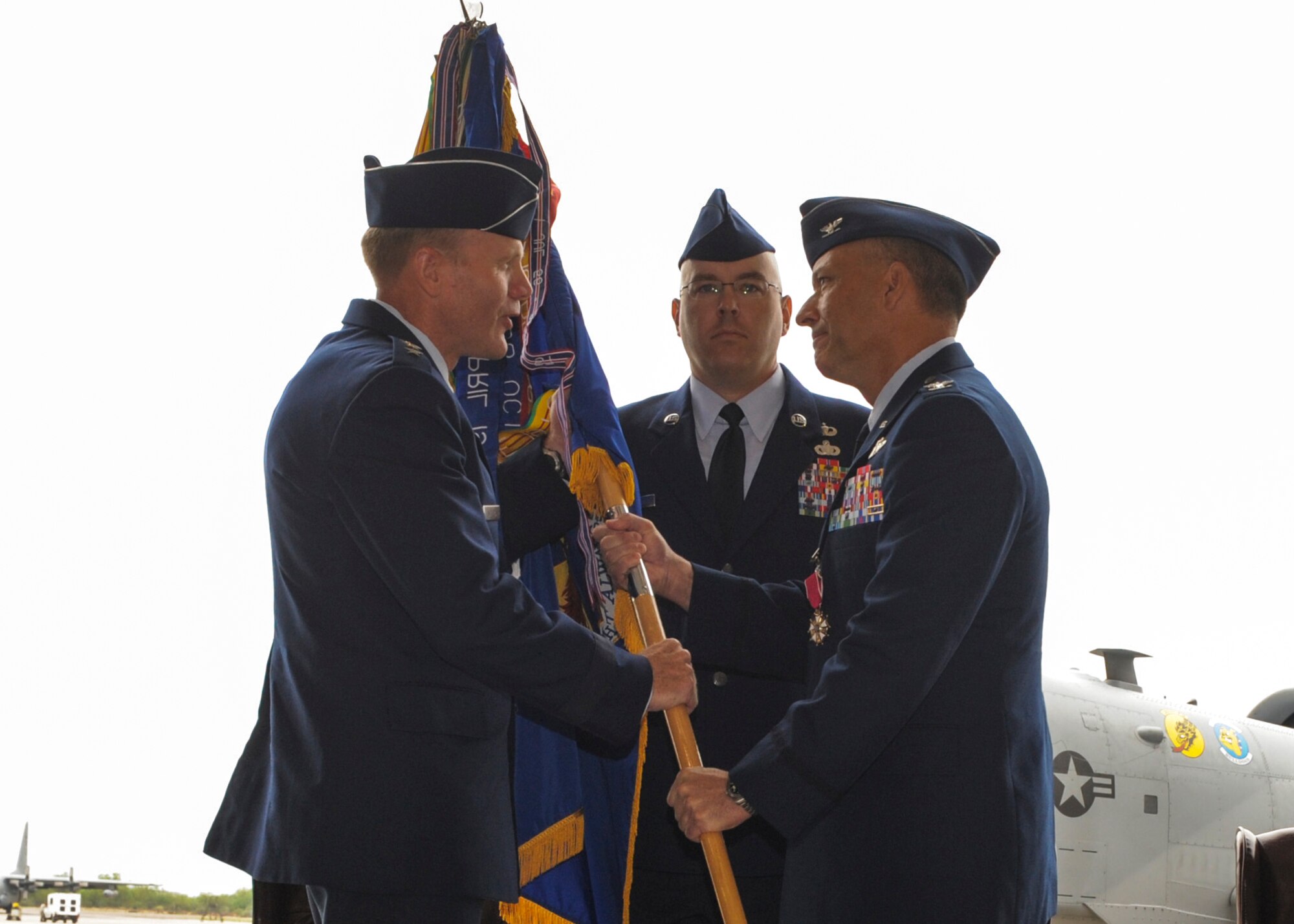 U.S. Air Force Lt. Gen. Tod D. Wolters, 12th Air Force (Air Forces Southern) commander, receives the 355th Fighter Wing guidon from Col. Kevin E. Blanchard during a change of command ceremony at Davis-Monthan Air Force Base, Ariz., Aug. 1, 2014. Blanchard relinquished command of the 355 FW to Col. James P. Meger and will retire from the U.S. Air Force after 23 years of service.  (U.S. Air Force Photo by Airman 1st Class Chris Drzazgowski/Released) 