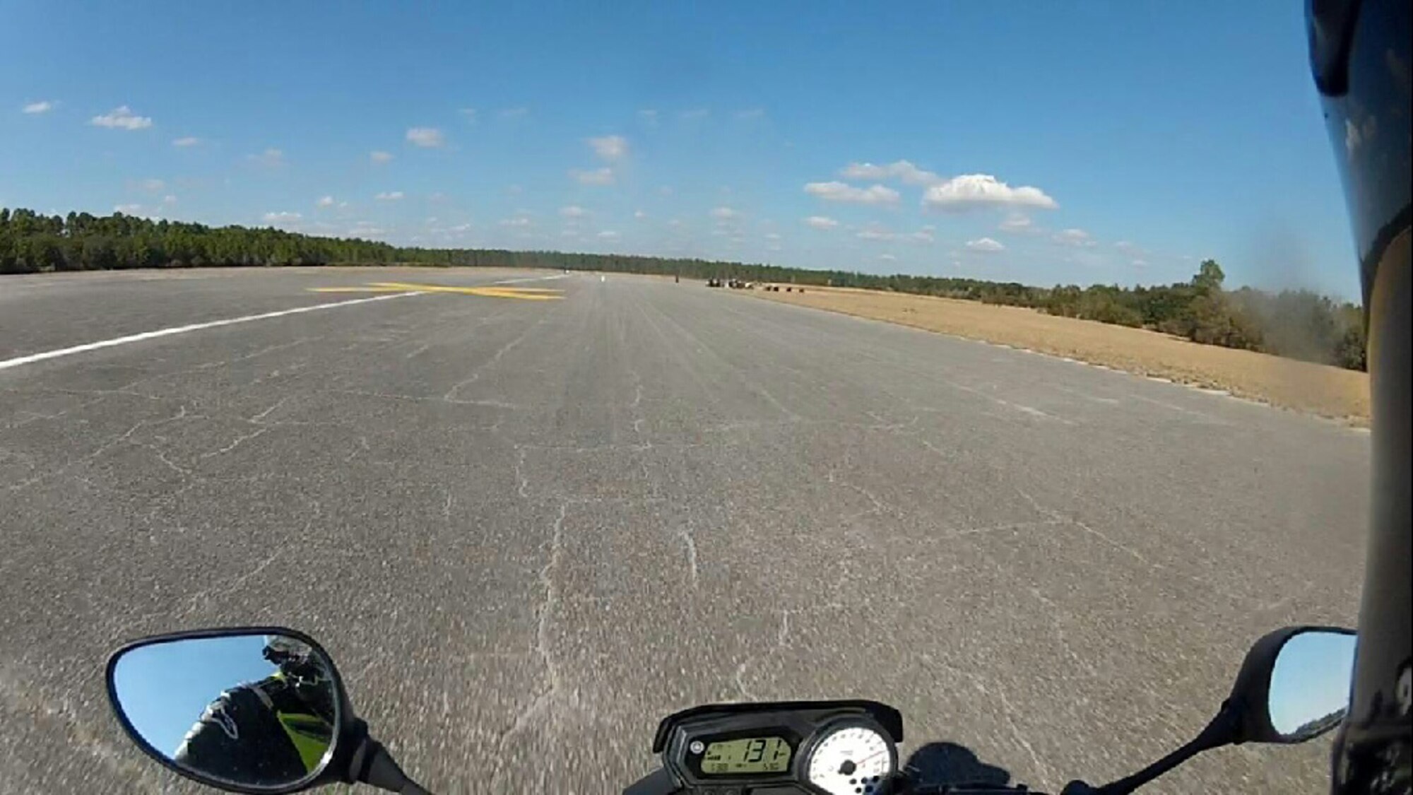 A motorcyclist drives on an abandoned runway. (Courtesy photo)