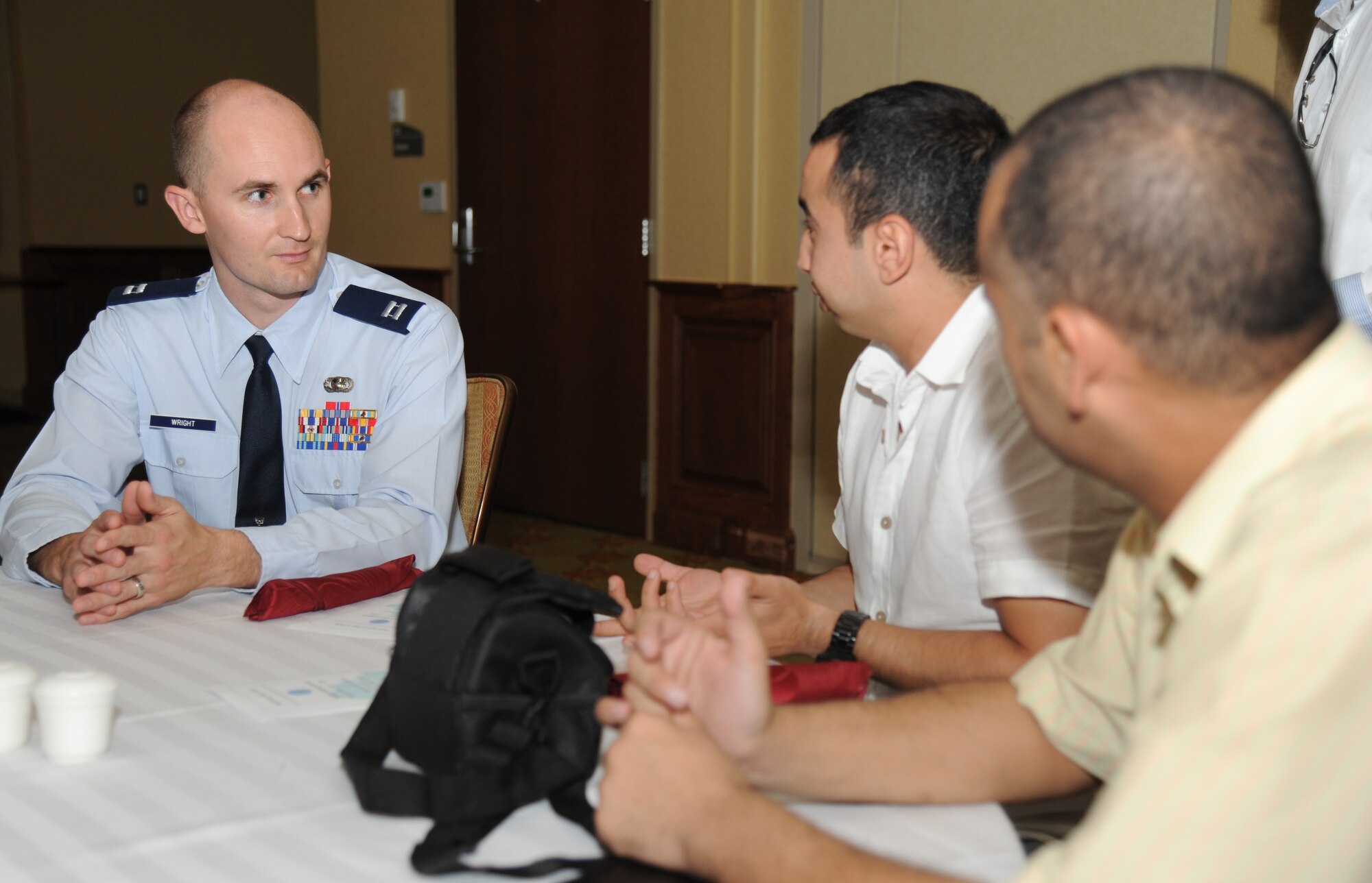 Capt. Benjamin Wright, 335th Training Squadron, speaks to Keesler international students during a luncheon to celebrate, Eid al-Fitr, July 28, 2014, at the Bay Breeze Event Center, Keesler Air Force Base, Miss. Ramadan is a month dedicated to worship and repentance. Muslims worldwide observe this month by fasting from dawn until sunset. Eid al-Fitr is a three-day celebration that marks the end of Ramadan. (U.S. Air Force photo by Kemberly Groue)
