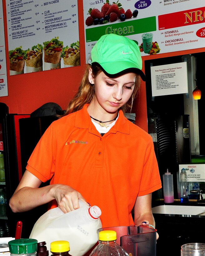 Hanna True, Smoothalicious employee, prepares a smoothie for a customer June 6. Smoothalicious is located inside of the Offutt Field House and offers a variety of sandwiches, salads and their specialty, smoothies. (U.S. Air Force photo by D.P. Heard/Released)